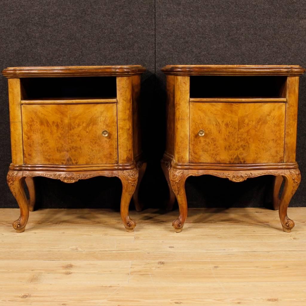 Pair of Italian bedside tables from the 20th century. Nicely carved furniture in walnut and burl. Built-in marble top in excellent condition. Night stands with an external compartment and a door of good service. They show some signs of wear, overall