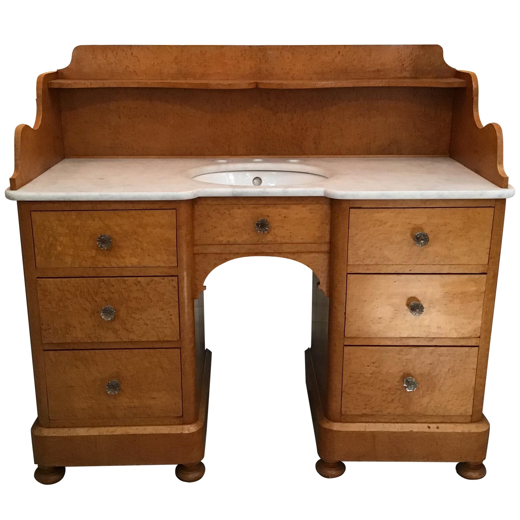 Pair of Italian brier-root veneer with Carrara marble wash stand cabinets from early 20th century
These sinks are equipped with six drawers and one shelf
The Carrara marble top is provided for a three holes faucet and comes with a porcelain