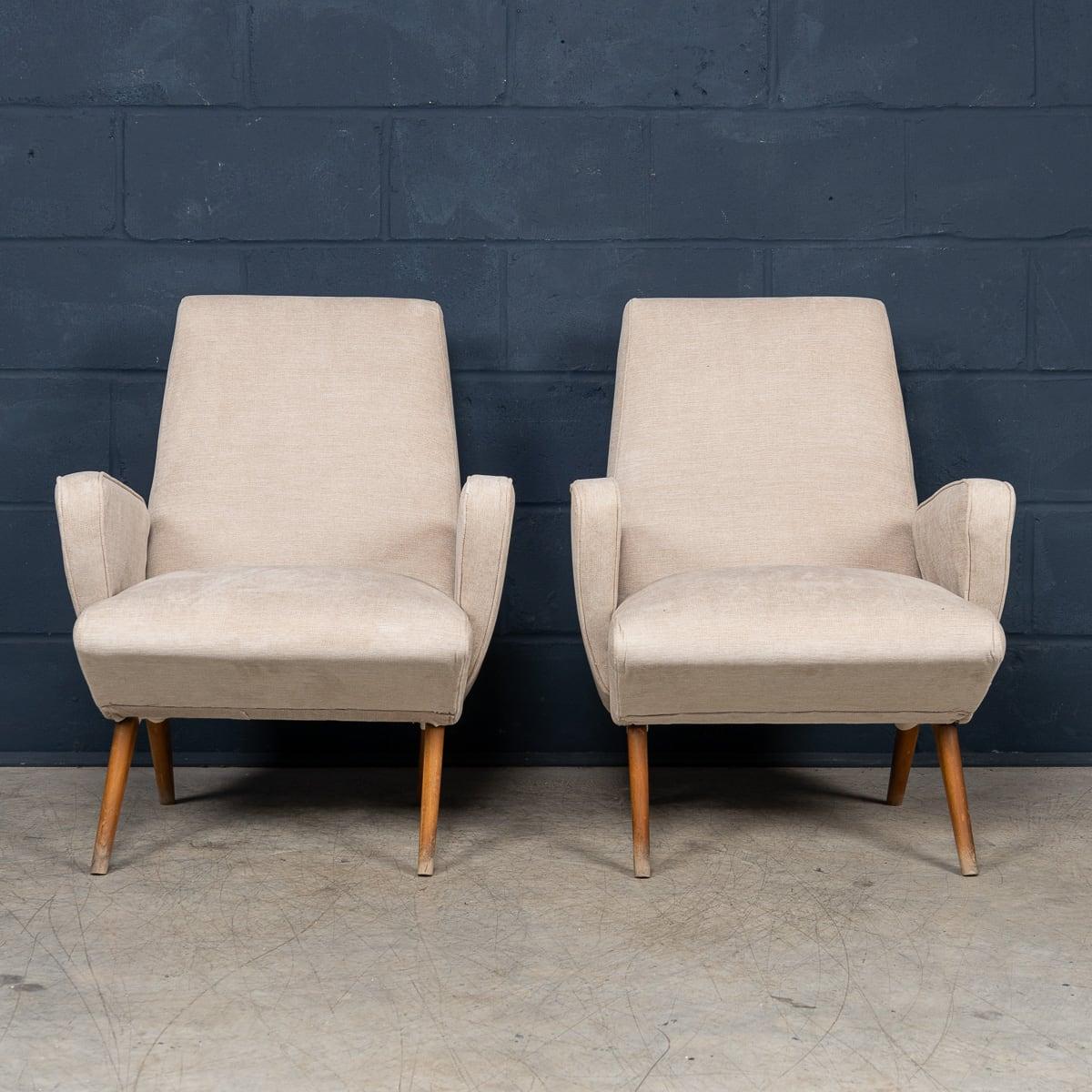 A striking pair of armchairs designed by Nino Zoncada, crafted in Italy during the 1950s. These armchairs have been reupholstered in pristine off-white fabric, enhancing their timeless elegance while preserving their mid-century charm.

The