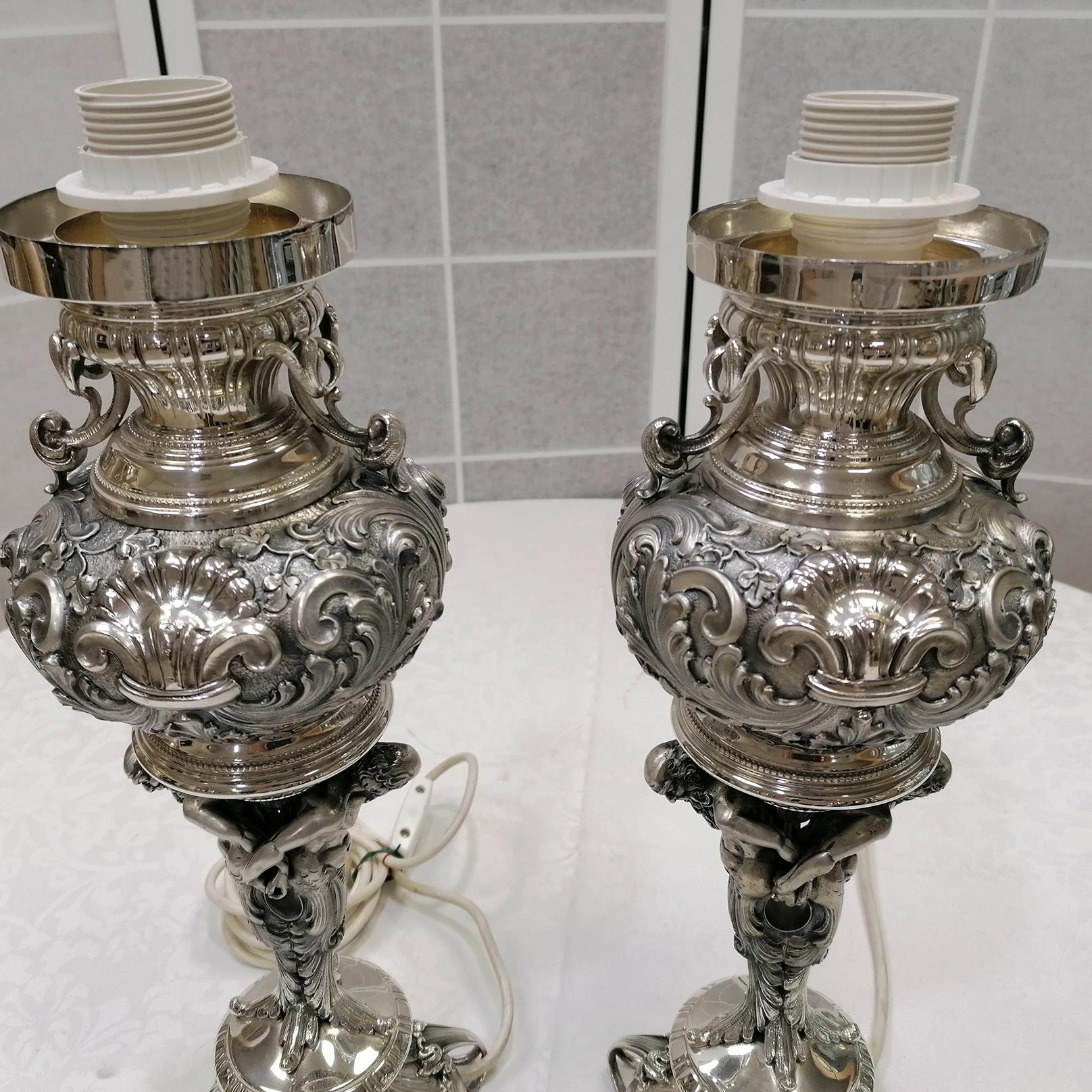 Cast 20th Century Pair of Italian Silver embossed with figures Lamps For Sale