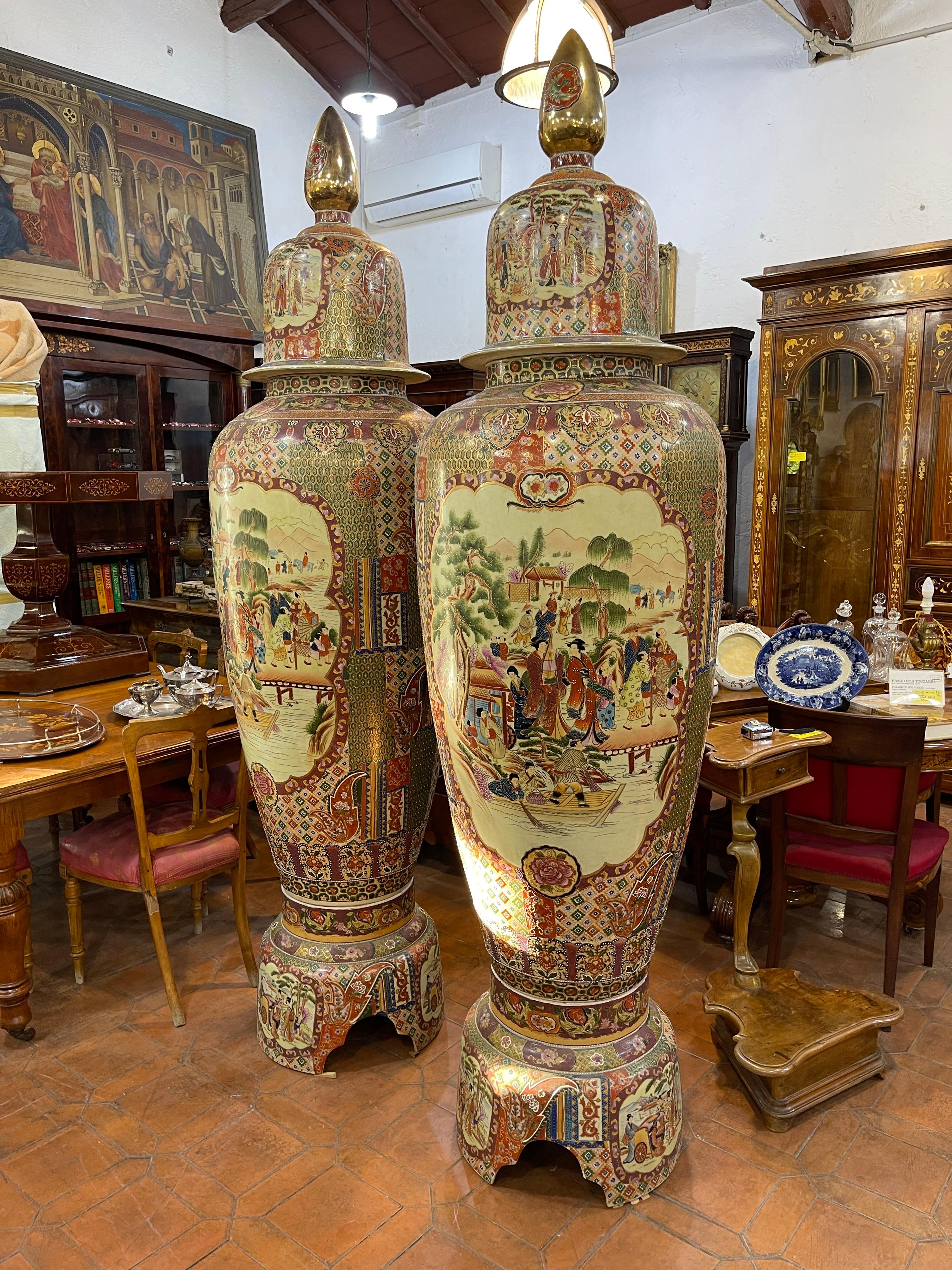 Monumental pair of Japanese vases, hand painted, gilt and worked also in relief. The vases are in three pieces, are in very good condition and do not have cracks or small cracks. 
Period mid-twentieth century, precisely between 1955 and 1960.