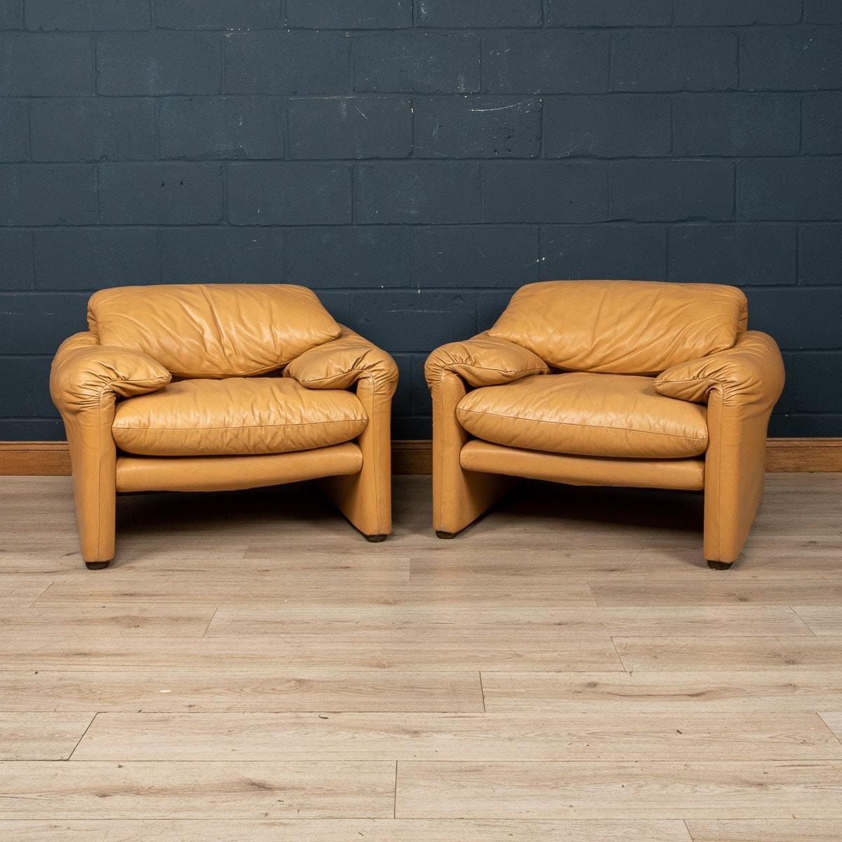 A pair of “675 Maralunga” armchairs in original beige leather upholstery. The Maralunga sofa was designed by Vico Magistretti in the early 1970s for Cassina. Cosy and adaptable, the ever cool sofa was an instant classic. Comfort comes in 2 forms