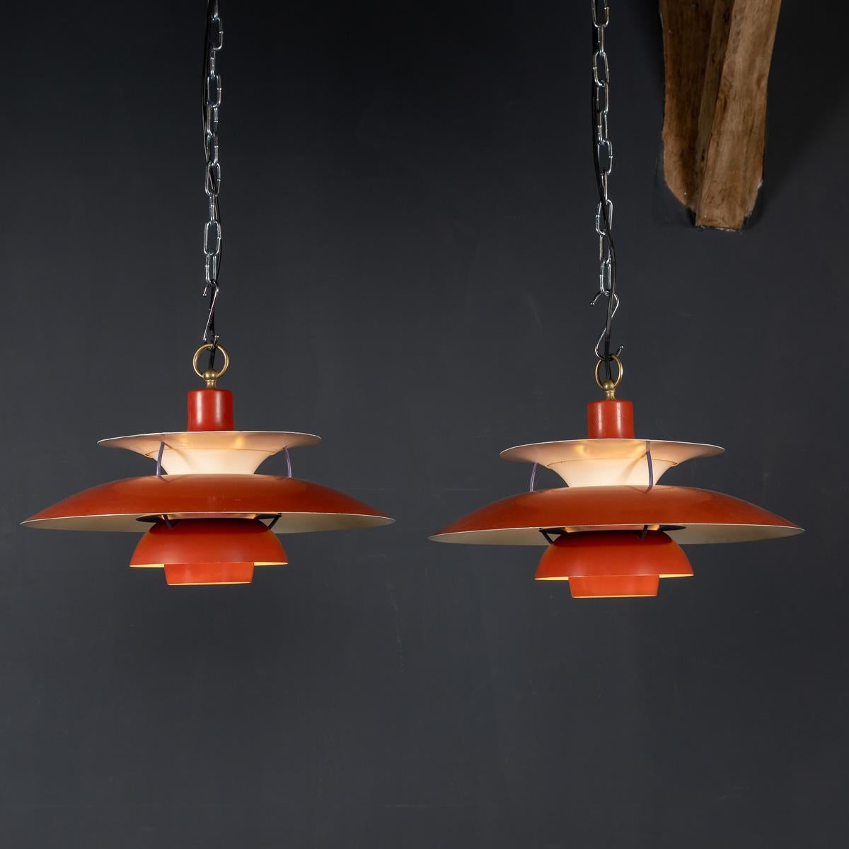 A pair of mid 20th century Louis Poulsen PH5 metal shade light manufactured by Danish company Paul Henningsen between 1960 - 1970 with original orange colour paint.

Condition
In great condition - wear consistent with age.

Size
Diameter: