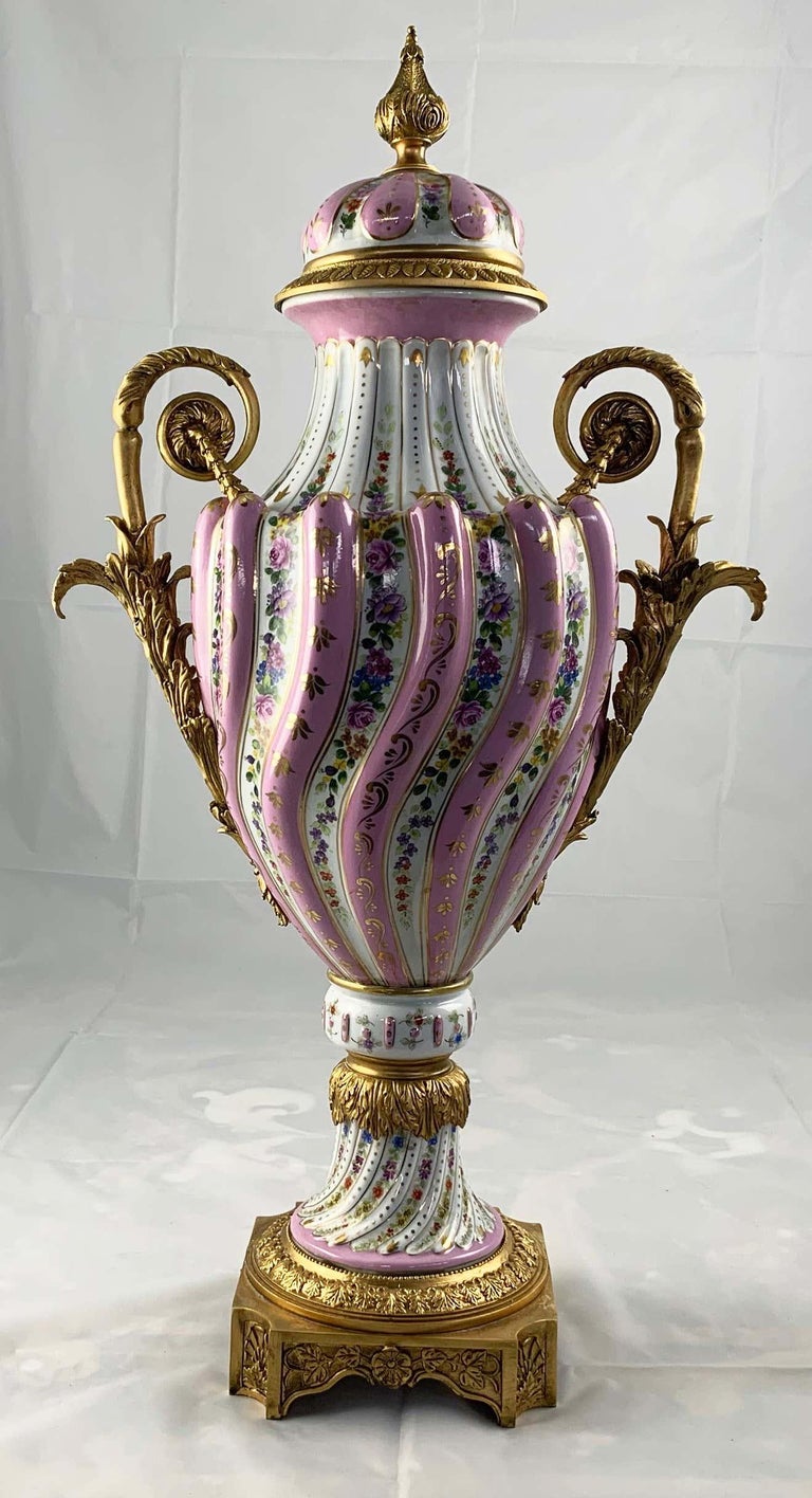 20th Century Pair of Ormolu Mounted Pink Sevres Style Vases with Lids