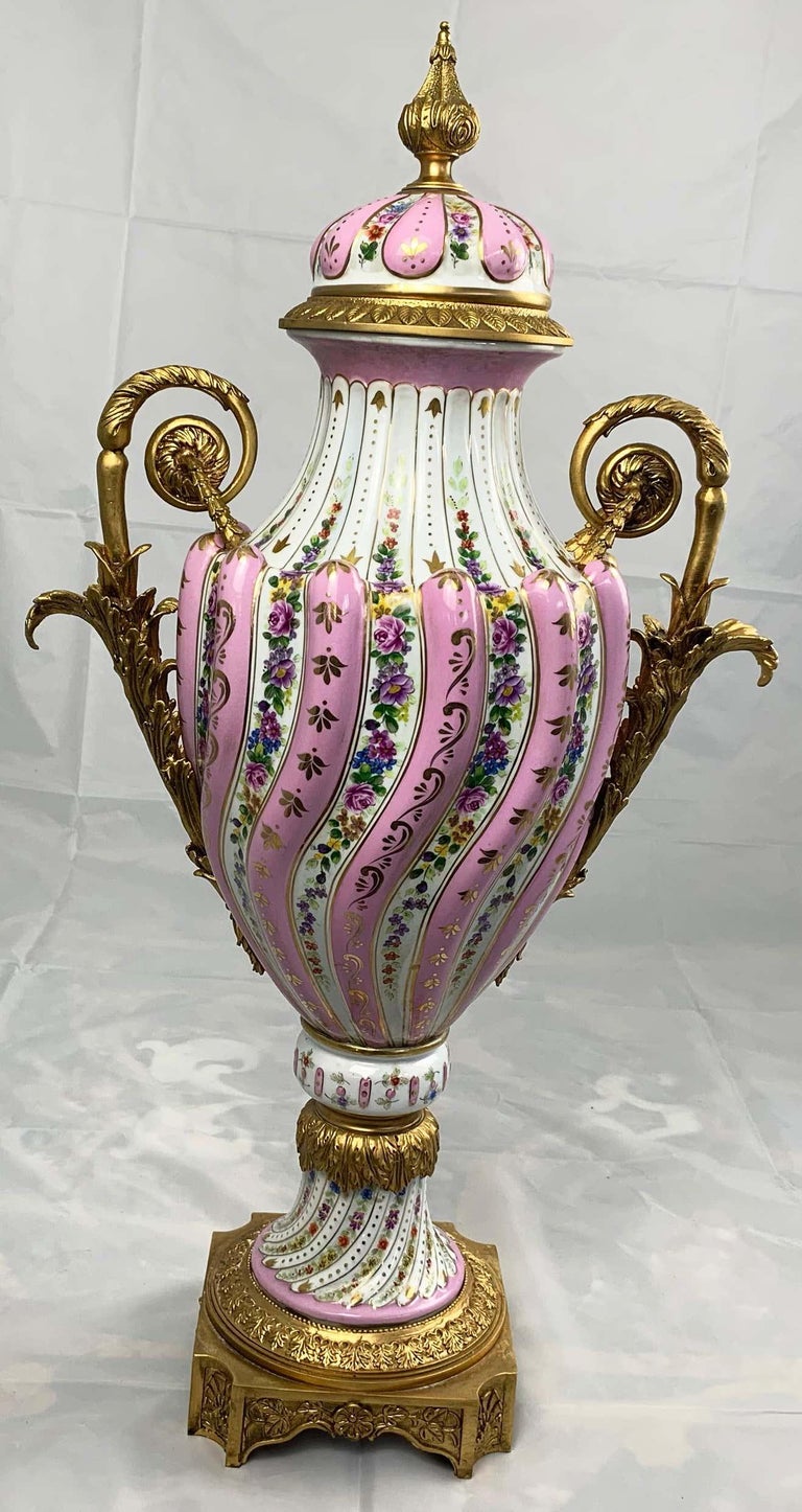 20th Century Pair of Ormolu Mounted Pink Sevres Style Vases with Lids