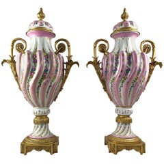 20th Century Pair of Ormolu Mounted Pink Sevres Style Vases with Lids