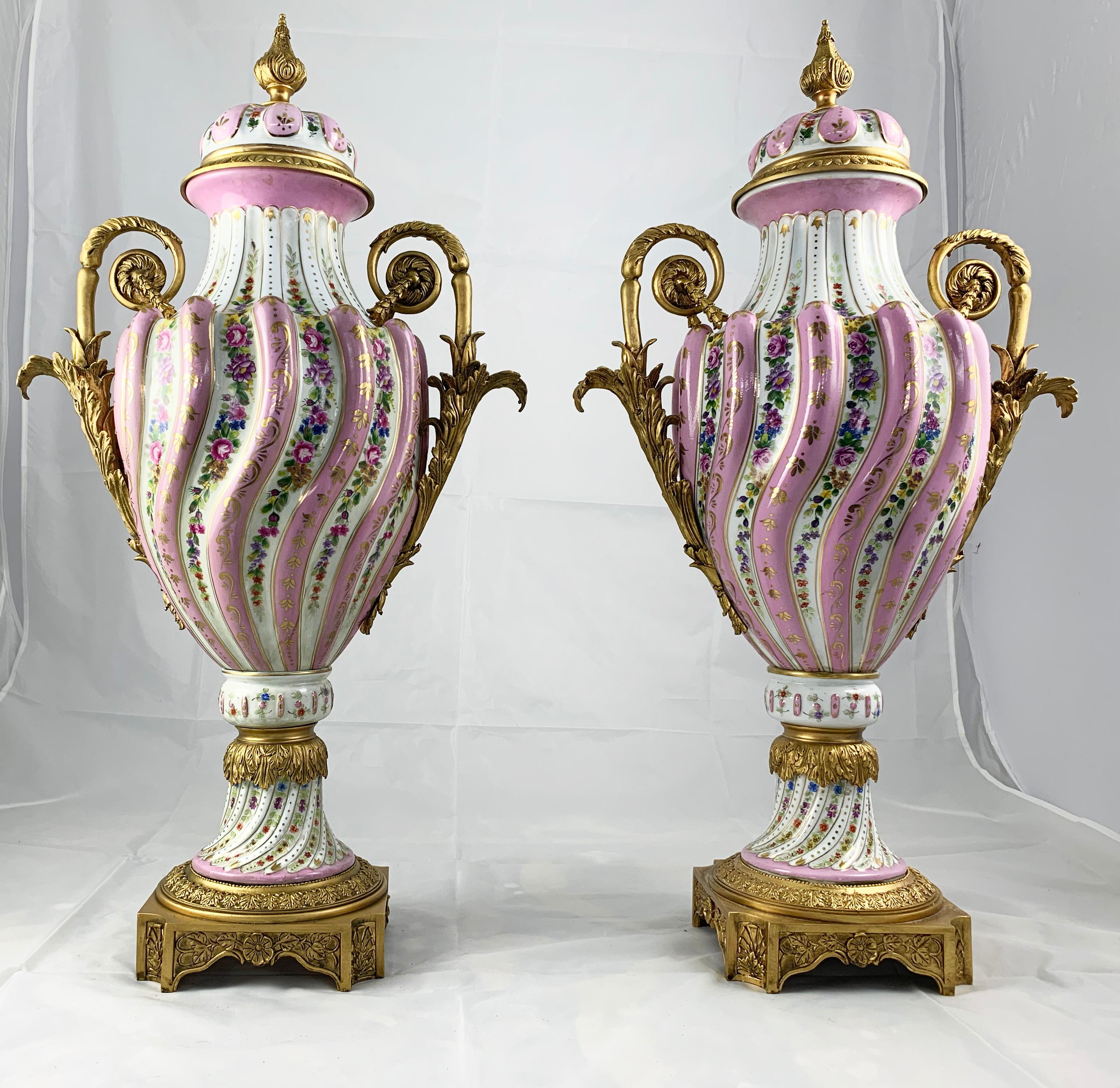 French 20th Century Pair of Ormolu Mounted Pink Sevres Vases with Lids For Sale