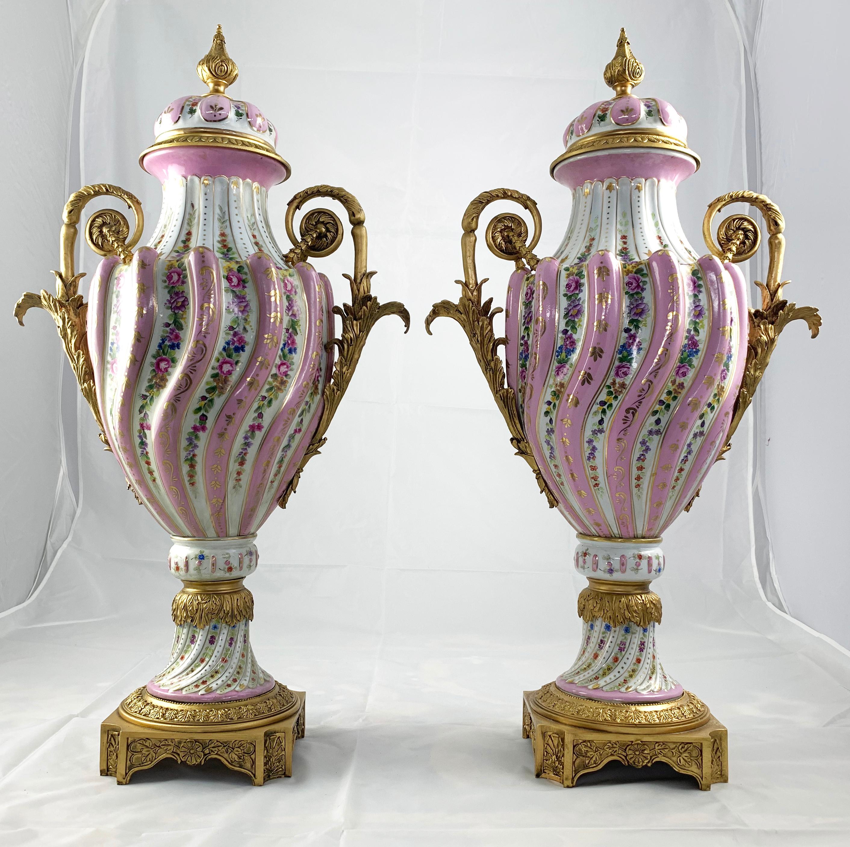 Hand-Crafted 20th Century Pair of Ormolu Mounted Pink Sevres Vases with Lids For Sale