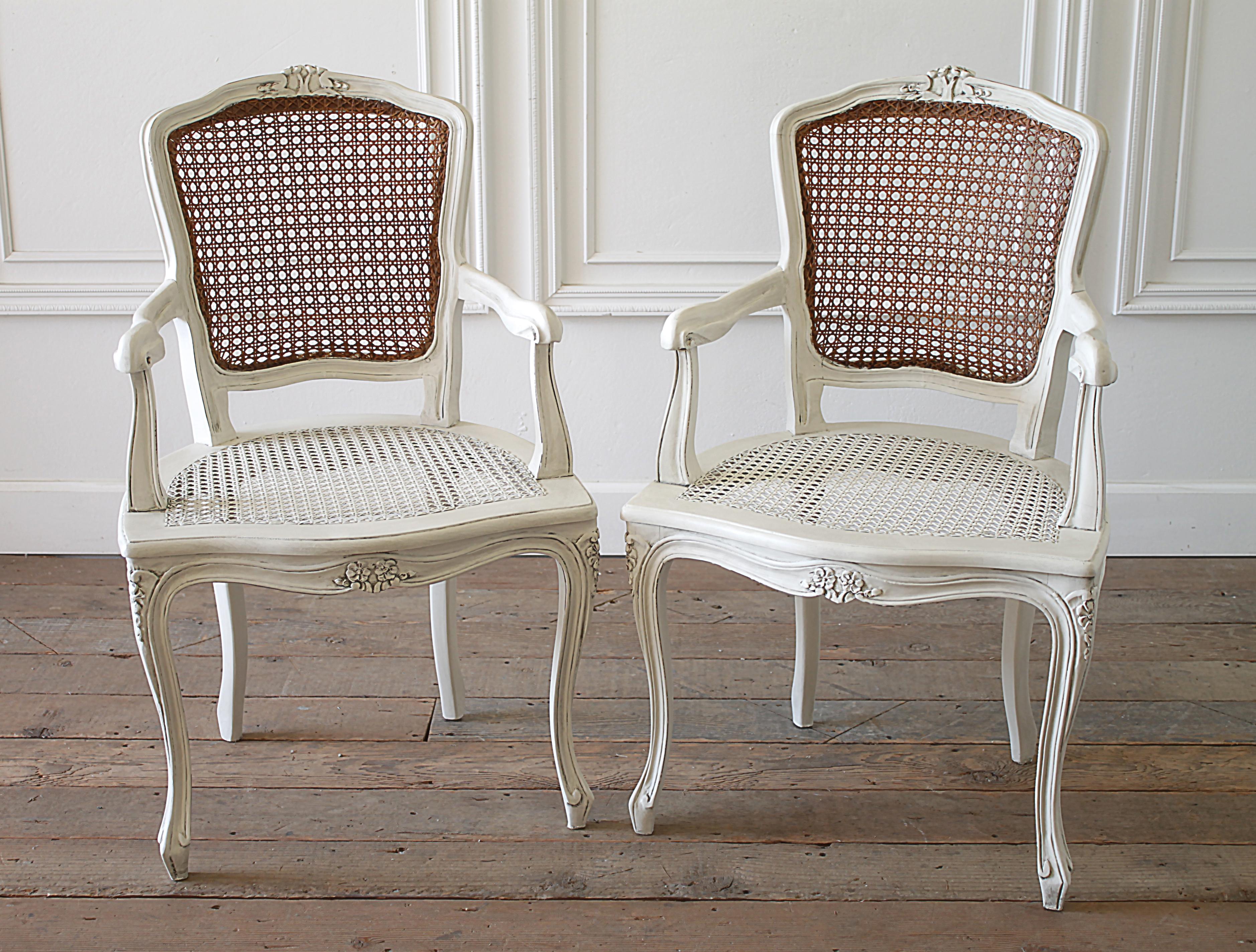 20th century pair of painted cane back open armchairs with linen slipcovers
Painted in our oyster white finish with natural original cane backs, we distressed the edges very lightly, and finished with and antique glazed patina. The cane seats are