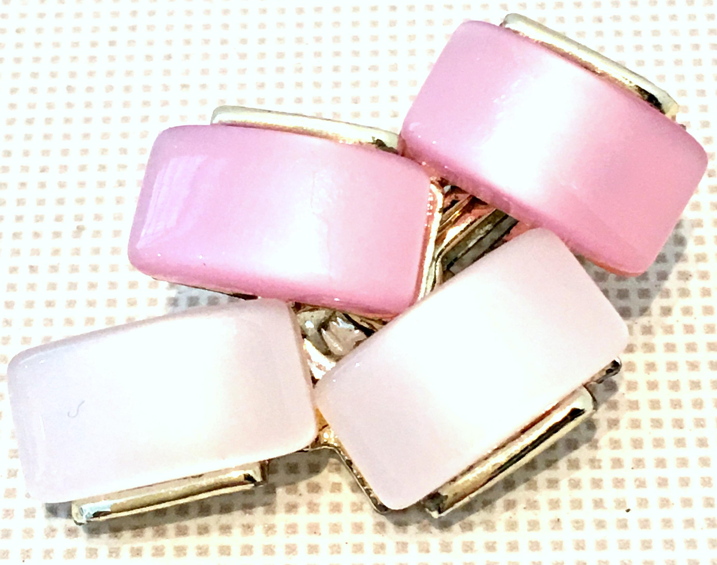 20th Century pair of silver and two tones of iridescent pink geometric Lucite stone clip style earrings by, Coro.