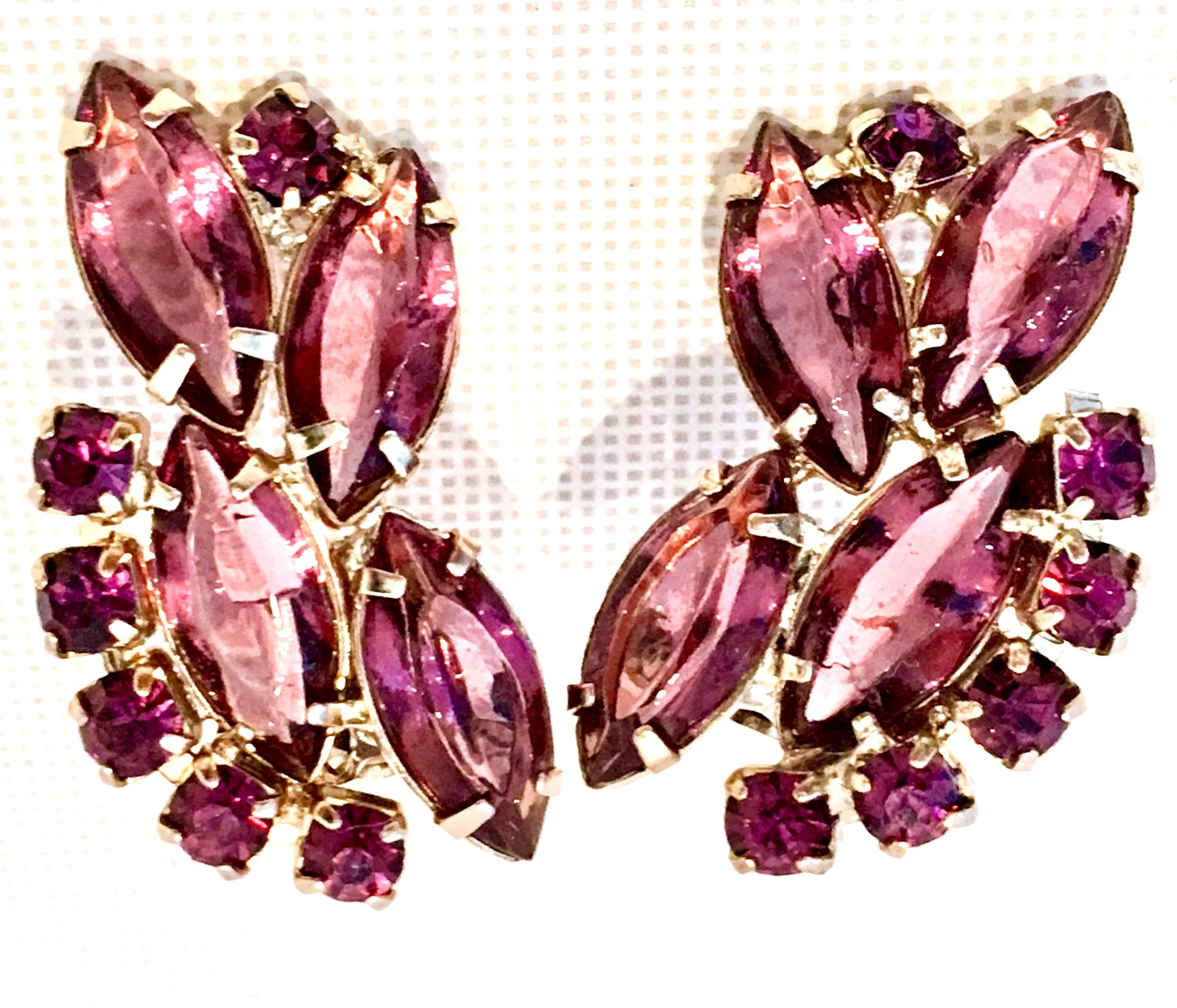 20th Century Pair Of Silver Amethyst Austrian Crystal Earrings. Features brilliant cut and faceted fancy prong set Austrian crystal stones and designed with a left and right fit. These clip style earrings have open back stones.