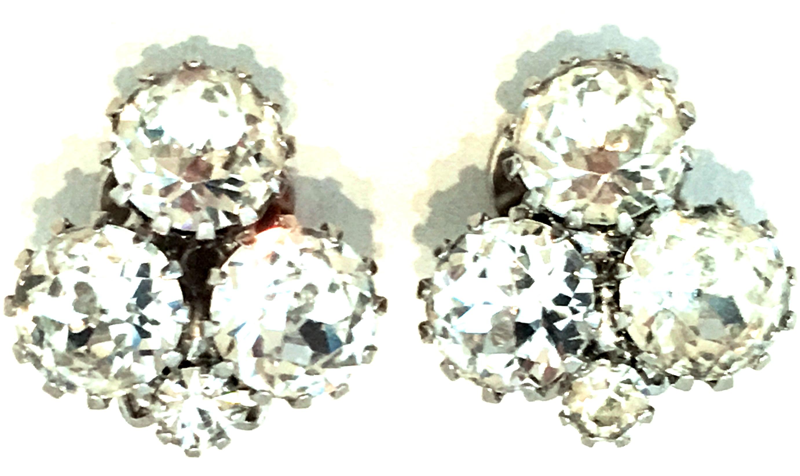 20th Century Pair Of Silver & Austrian Crystal Abstract Earrings By, Weiss. These classic and timeless finely crafted clip style earrings feature silver rhodium plate prong set brilliant cut and faceted colorless Austrian Crystal stones. 