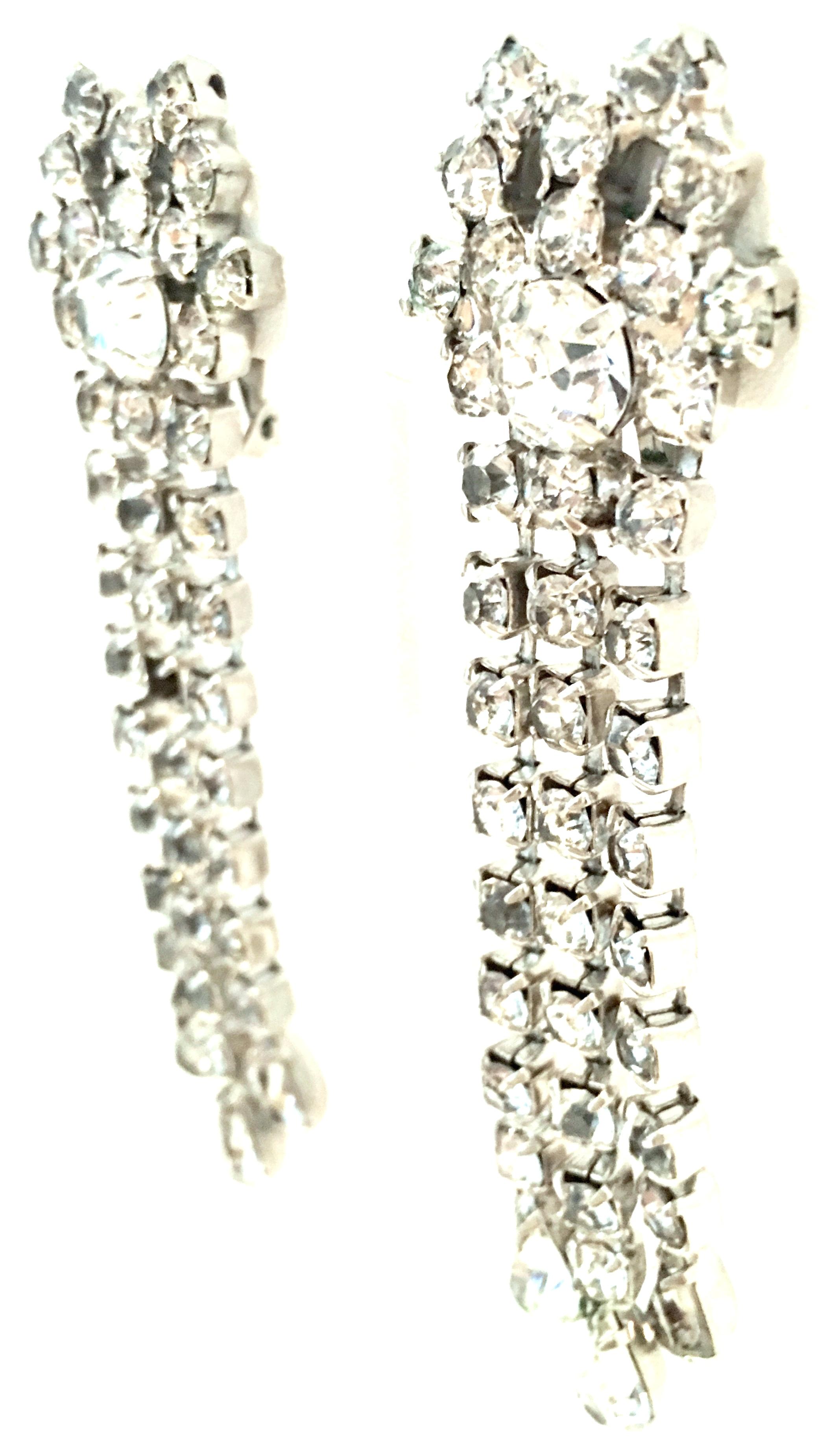 20th Century Pair of Silver Plate & Austrian Crystal Chandelier Earrings By, Garne. These silver plate clip style earrings feature prong set brilliant cut and faceted colorless Austrian crystal stones. Each signed on the underside, Garne