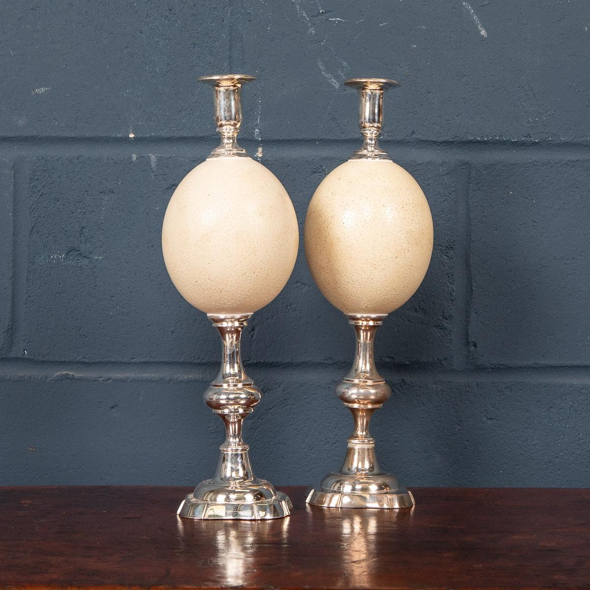 An unusual pair of silver plated candlesticks fashioned with an ostrich egg body, mid 20th century. A wonderful piece of design for anyone interested in natural history and a great addition to any room.

CONDITION
In good condition - wear and