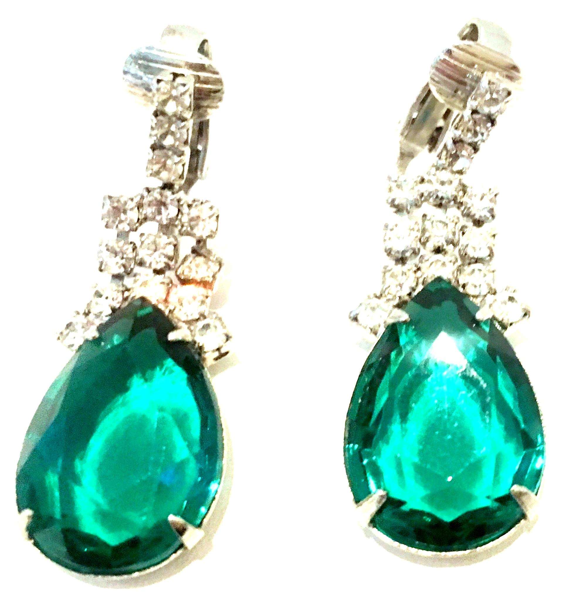 20th Century Pair Of Silver Plate & Swarovski Crystal Drop Earrings These classic and timeless silver rhodium plate clip style earrings have been executed with the highest quality of brilliant cut and faceted emerald green and colorless crystal