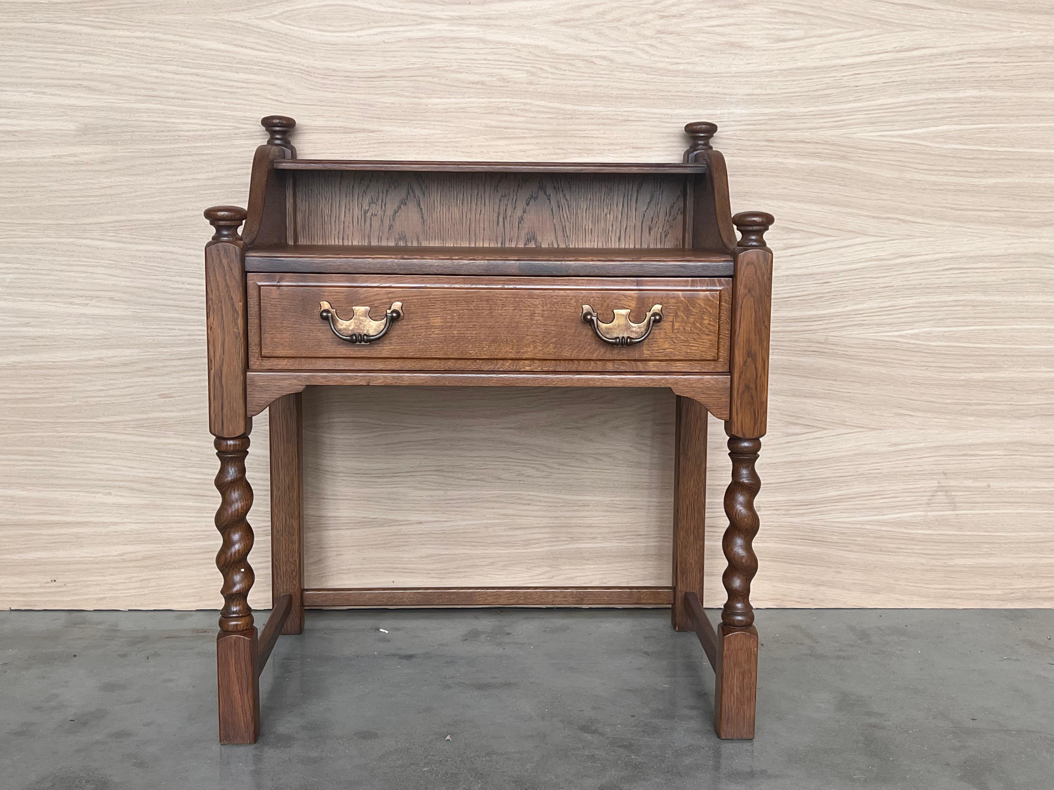 Spanish Colonial 20th Century Pair of Solid Carved French Nightstands with Low Shelve and crest For Sale