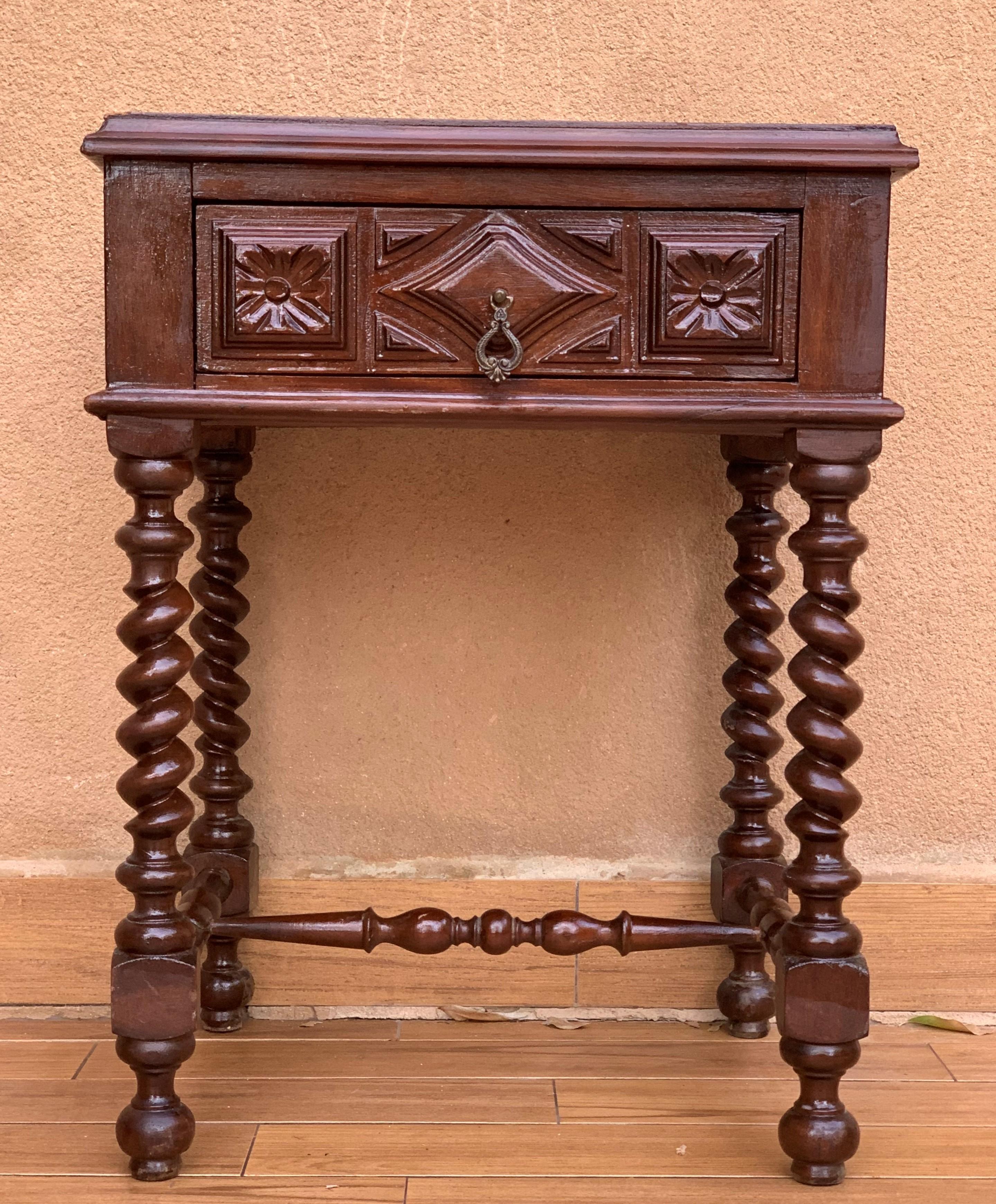 20th century pair of solid carved French nightstands with Solomonic columns
it has one carved drawer and wood T.form stretcher