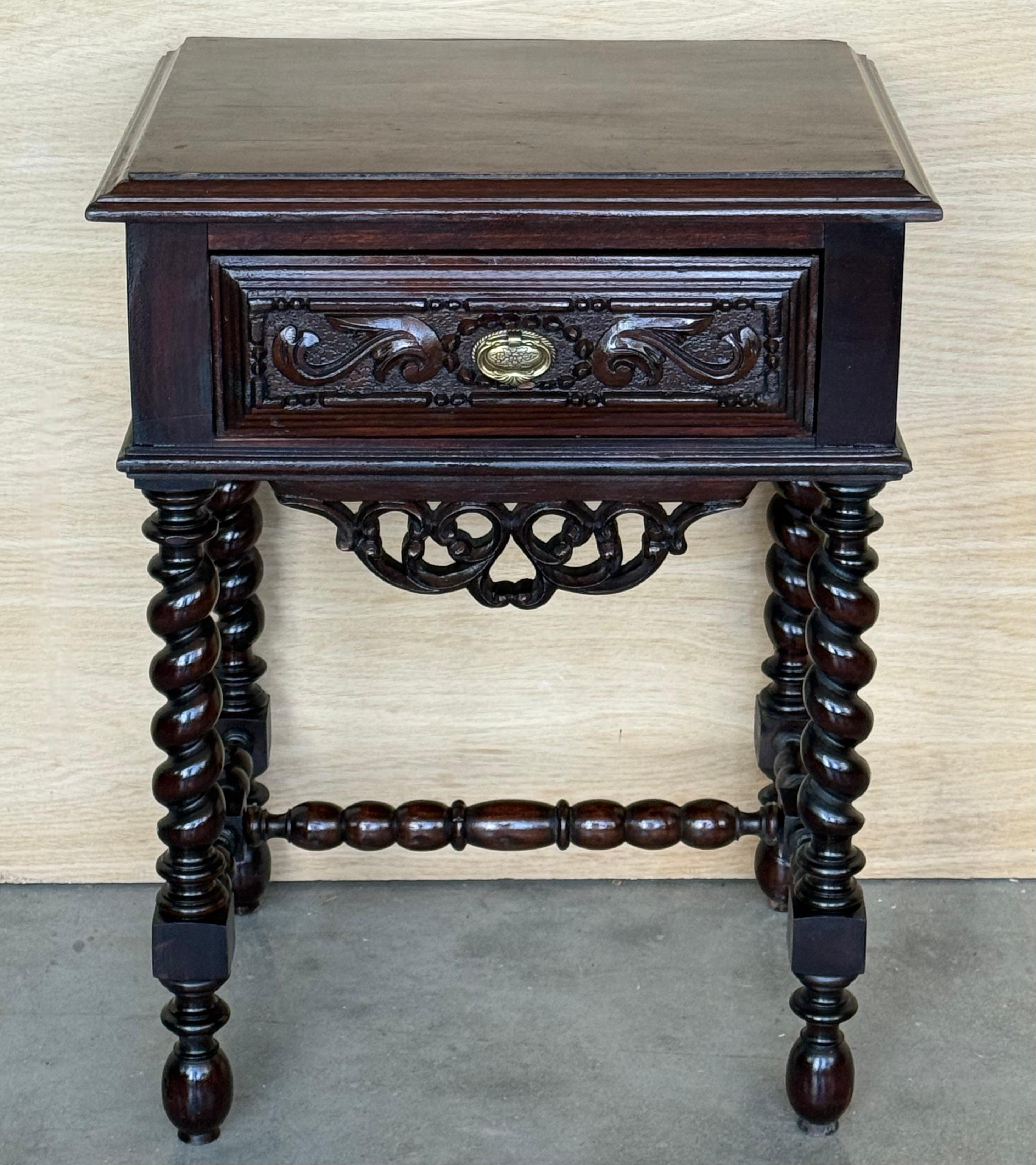 20th Century pair of solid carved French nightstands with Solomonic columns and turned stretches on each side.
It has one carved drawer with low crest as central decorative stretcher.