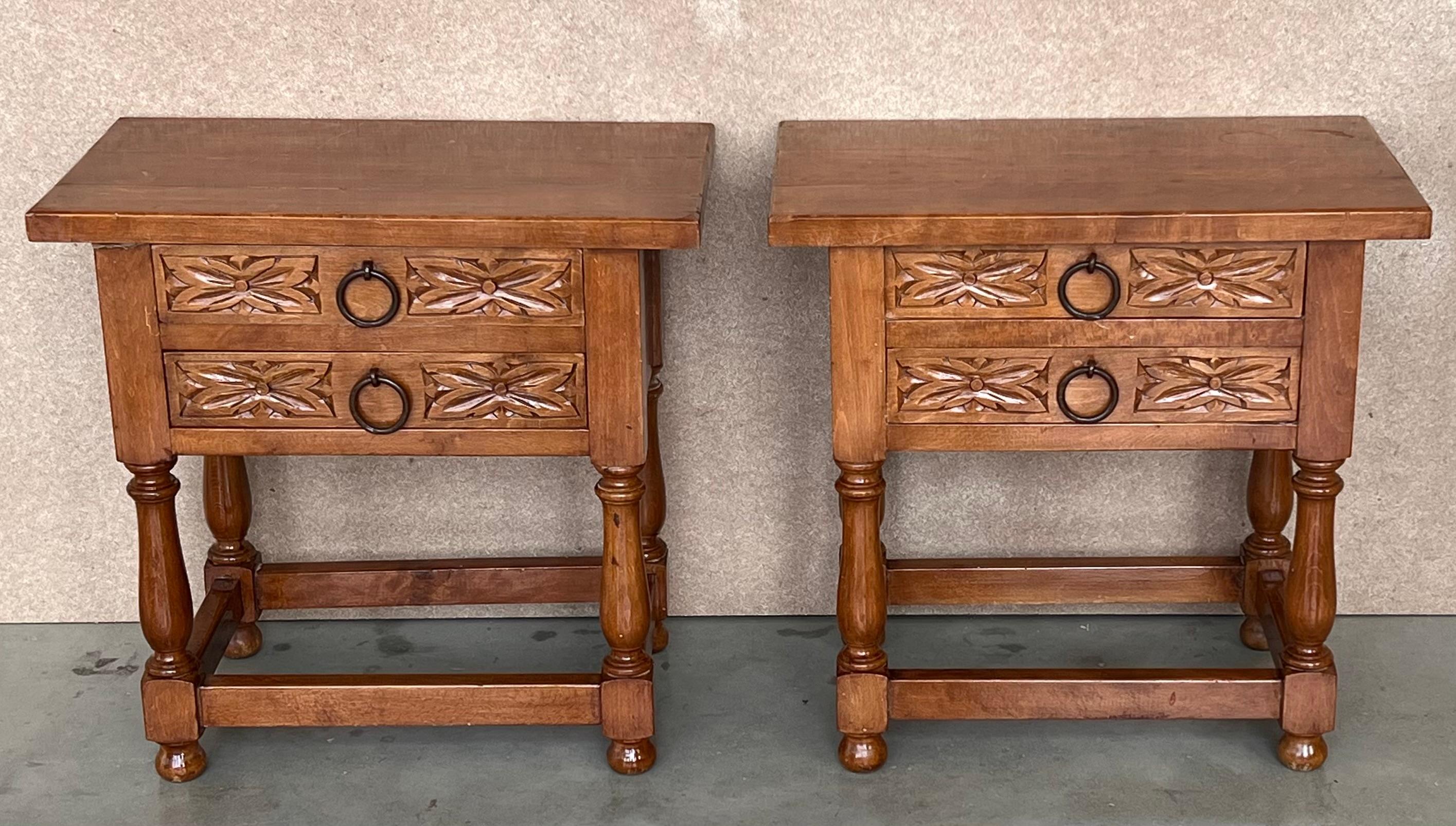 20th century pair of Spanish nightstands with two carved drawer and iron hardware.
Beautiful tables that you can use like a nightstands or side tables, end tables, or table lamp.
