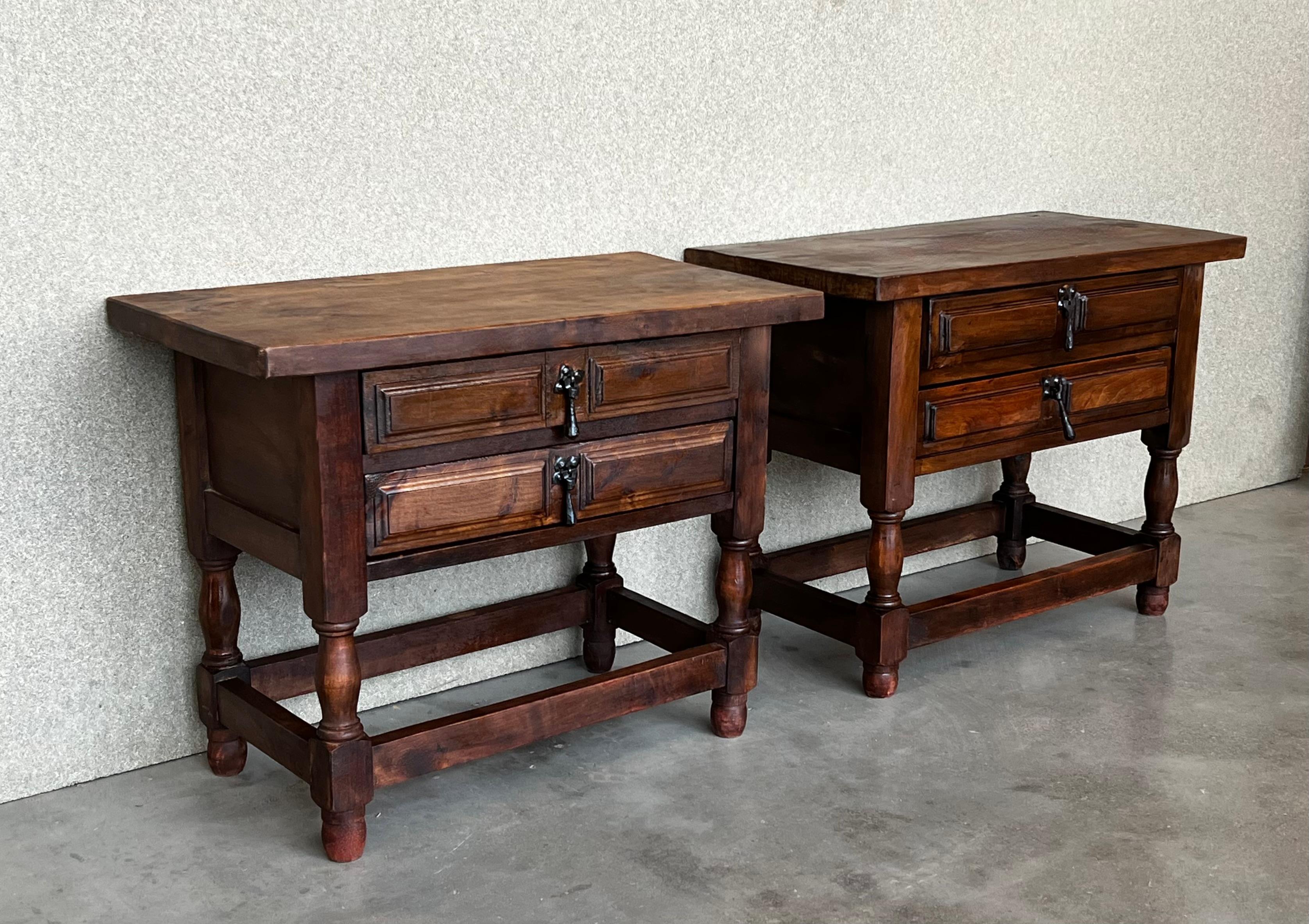 Carved 20th Century Pair of Spanish Nightstands with Two Drawers and Iron Hardware For Sale