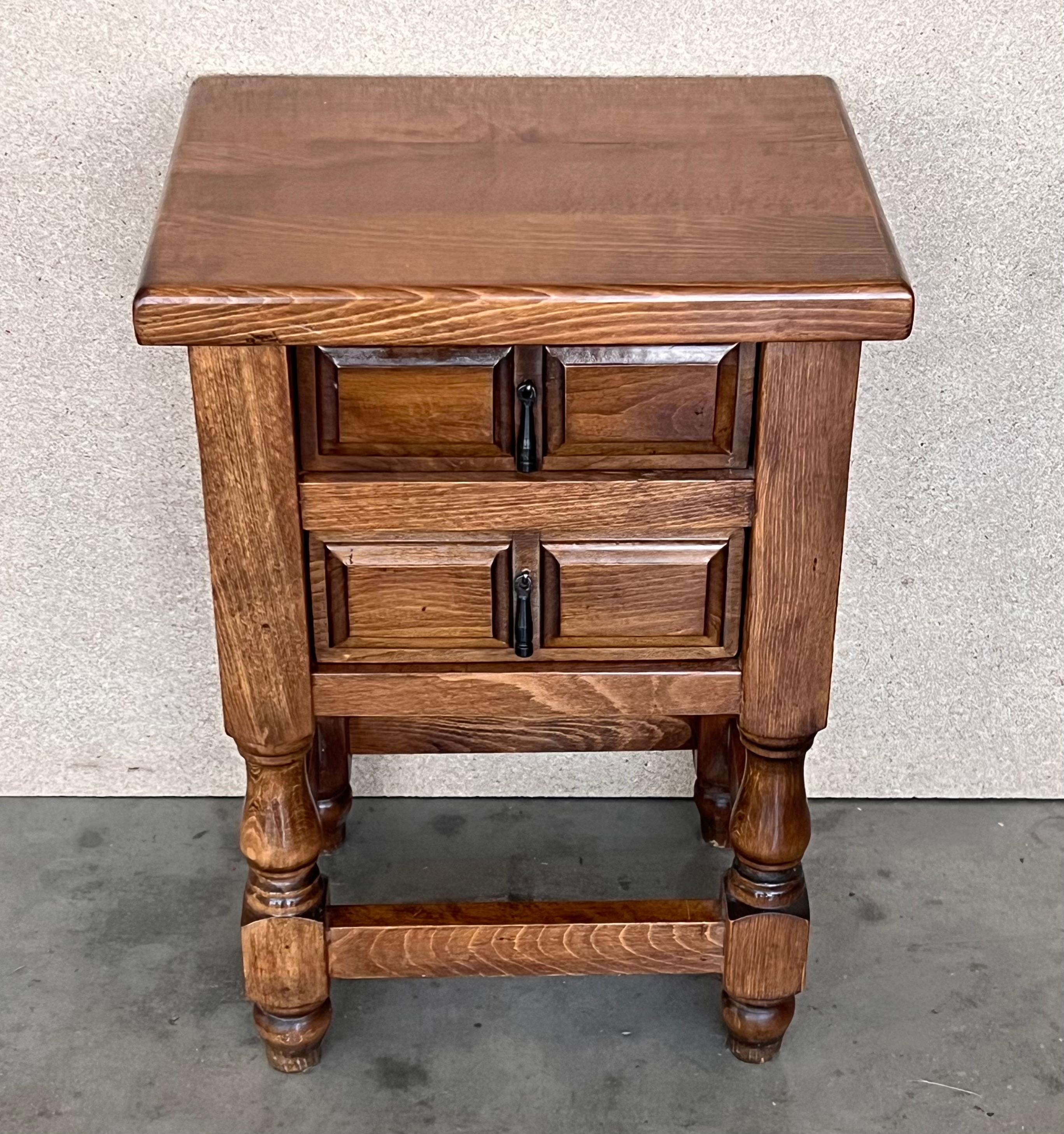 Carved 20th Century Pair of Spanish Nightstands with Two Drawers and Iron Hardware For Sale