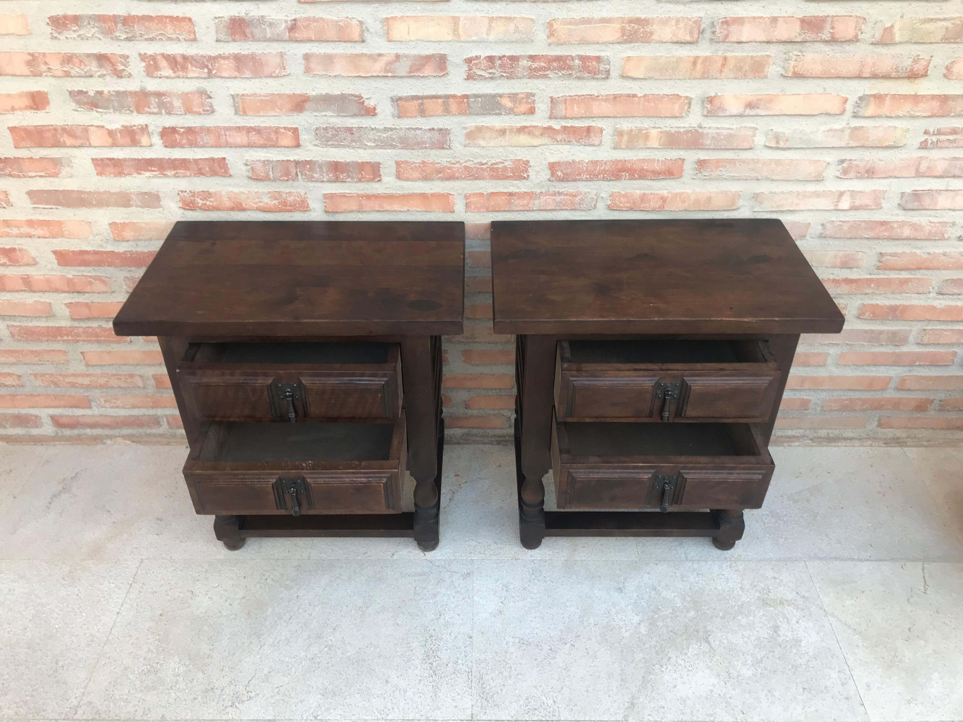 Carved 20th Century Pair of Spanish Nightstands with Two Drawers and Iron Hardware