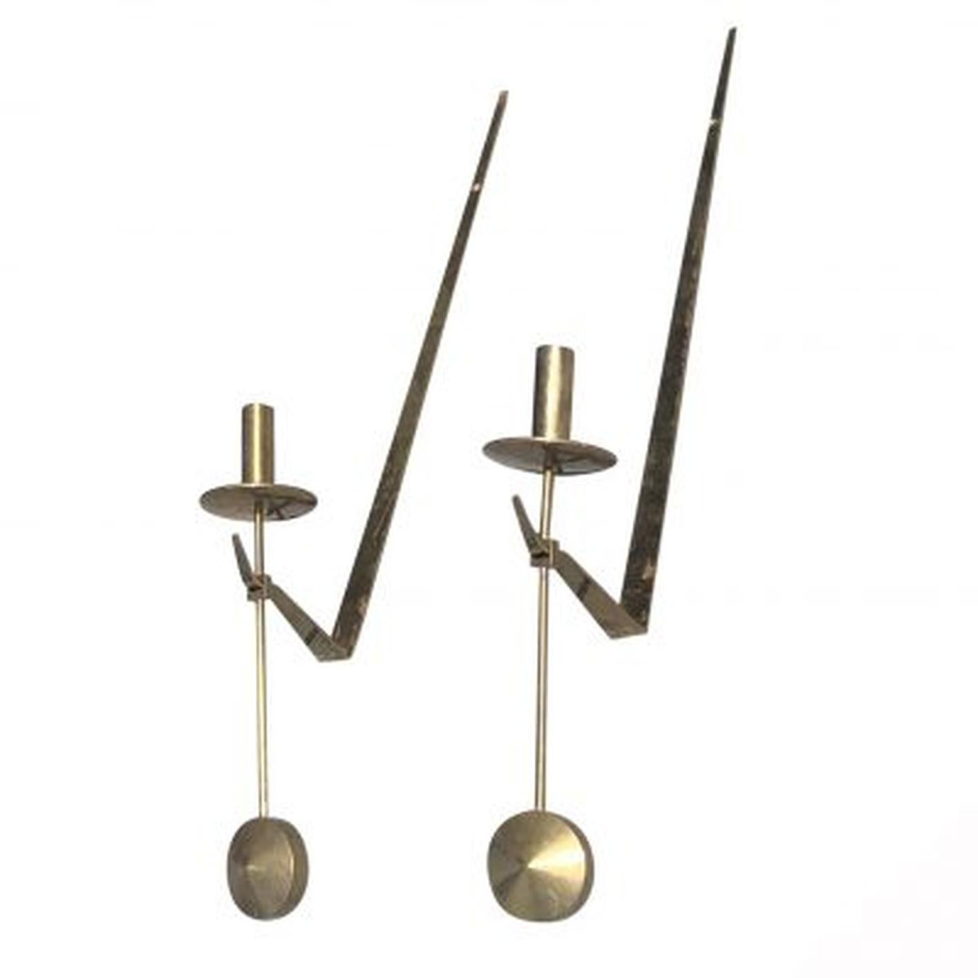 A wall-mounted pair of candleholders made out of brass by Pierre Forsell for Skultuna. Wear consistent with age and use, circa 1950-1960, Sweden Scandinavia.

Pierre Forsell was a Swedish silversmith and designer born in 1925 Stockholm, Sweden and