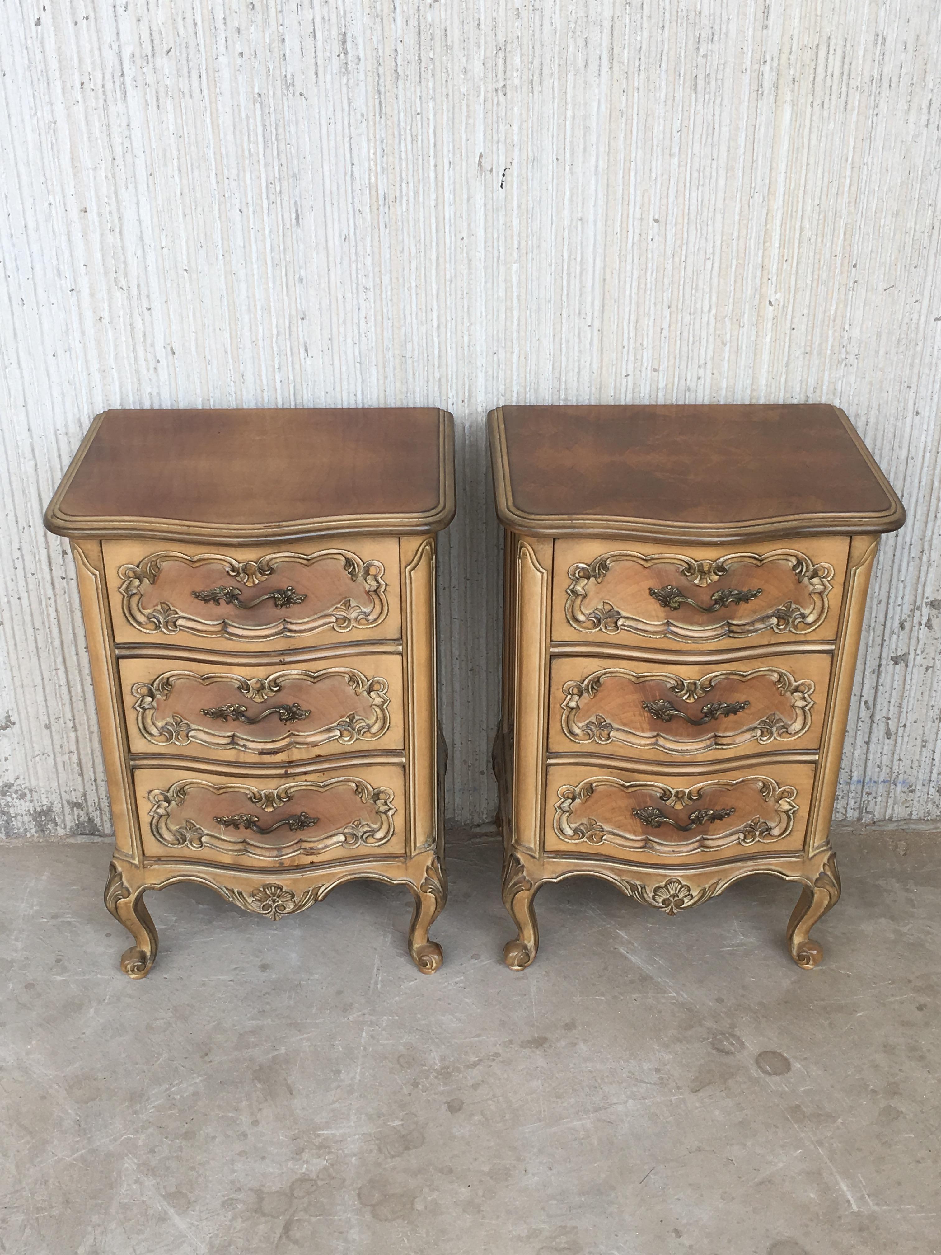 20th century pair of Swedish cream painted nightstands with three drawers.