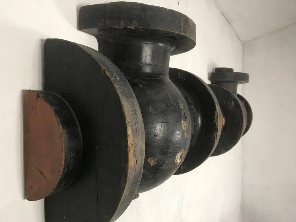 Fantastic looking pair of black painted foundry moulds in original black paint, sourced from a factory in Sheffield, northern England, a city famous for steel works. Originally, these would have been used to 'sand mould' cast iron pipe