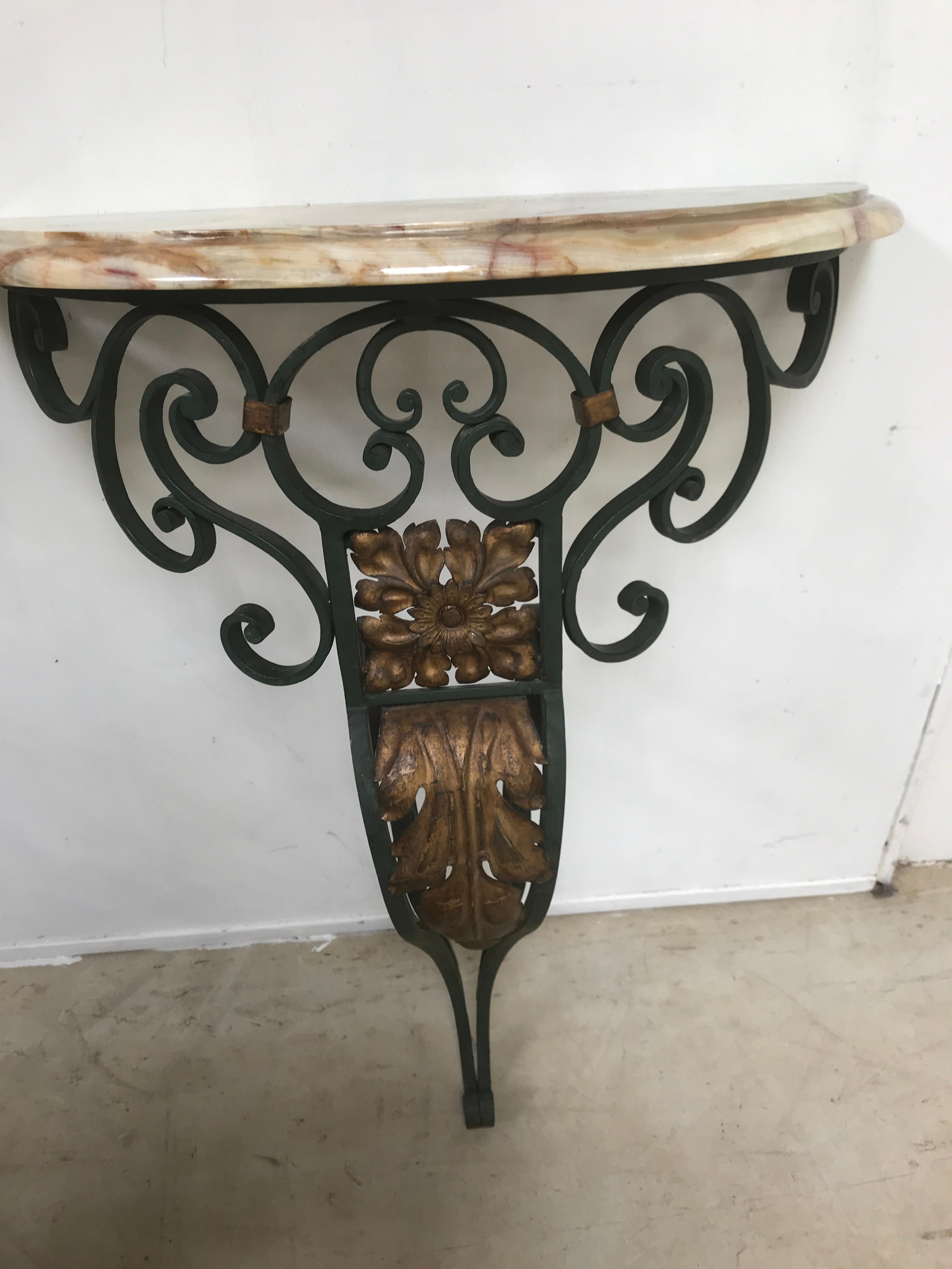 20th century pair of French wall mounted console tables. A very nice pair of metal and marble console tables. All in very good condition no damage to the marbles and original paint.