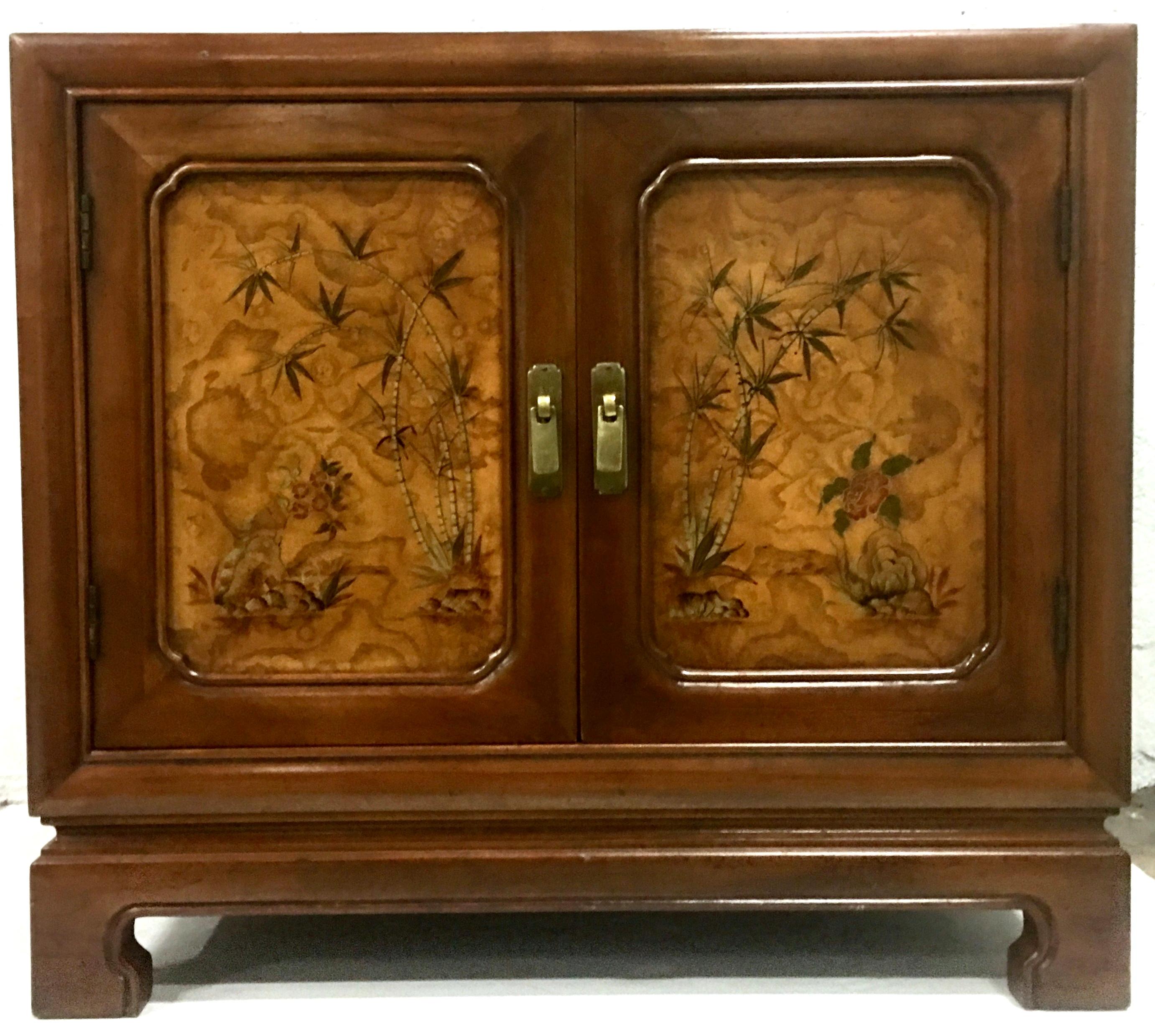 20th century pair of walnut and burl wood oriental style side tables or nightstands. Features exceptional quality walnut wood with front door panels of burl wood and hand painted Oriental motif. Original burnished solid brass pulls. Each piece