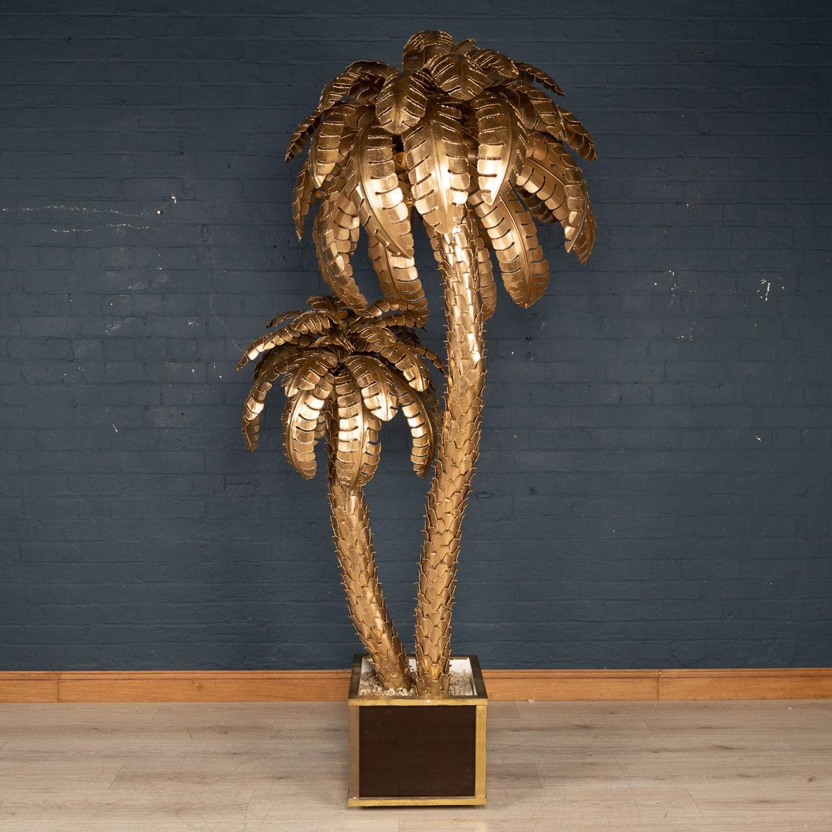 A massive and very rare Maison Jansen palm tree floor lamp dating from the 1960s-1970s, with eight light points. Of fantastic proportions and superb quality, a wonderful piece of interior design from the latter part of the last century giving a