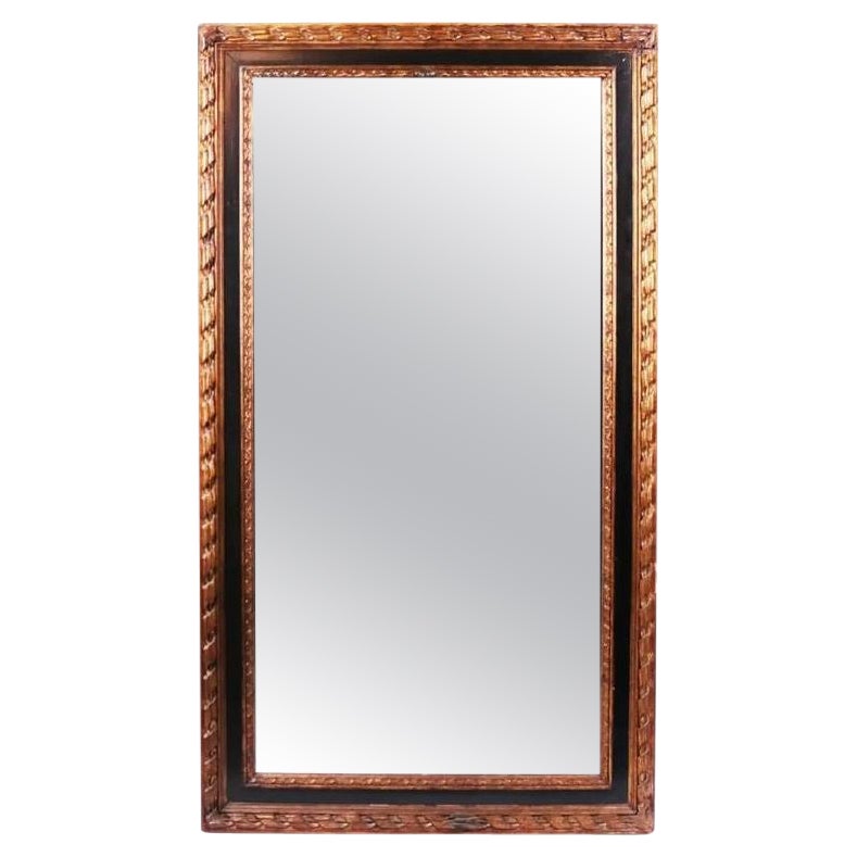 Miroir en bois doré et ébénisterie du XXe siècle