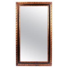 Miroir en bois doré et ébénisterie du XXe siècle