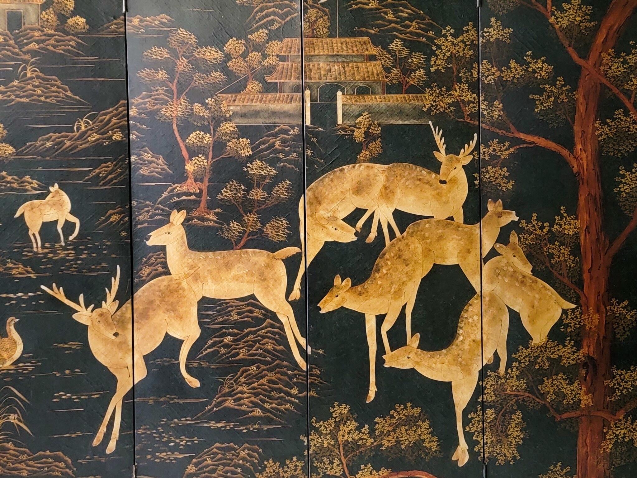 This is a late 20th century large 4 panel chinoiserie folding screen with unusual forrest and deer pagoda motif. It is lined with nailheads, and appears to be a wallpaper applied to board.