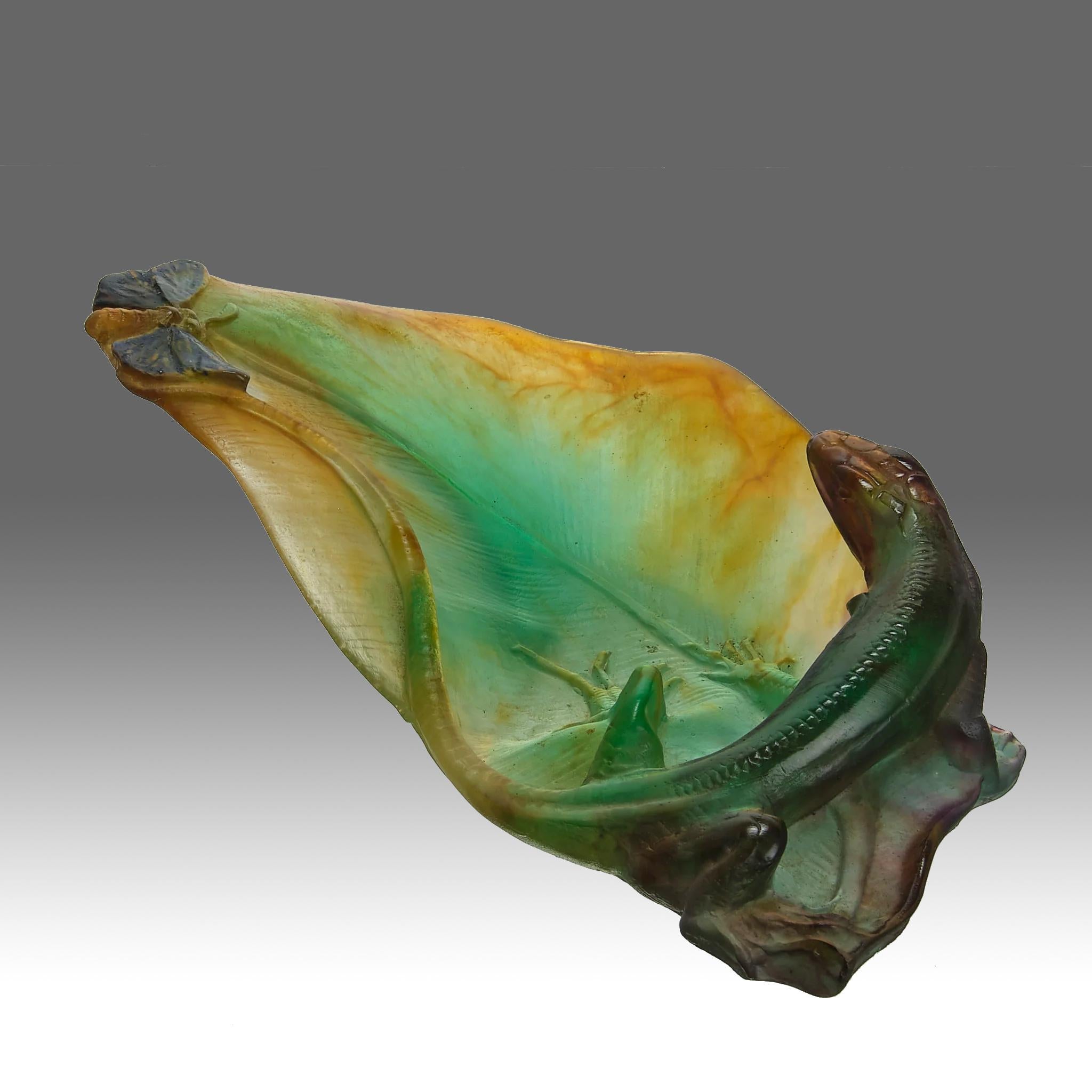 A highly attractive mid 20th Century French pâte-de-verre glass tray sculpture decorated with with a lizard and a butterfly relaxing on a lily pad with excellent vibrant colours and fine detail, signed Daum France

ADDITIONAL INFORMATION
Height:    