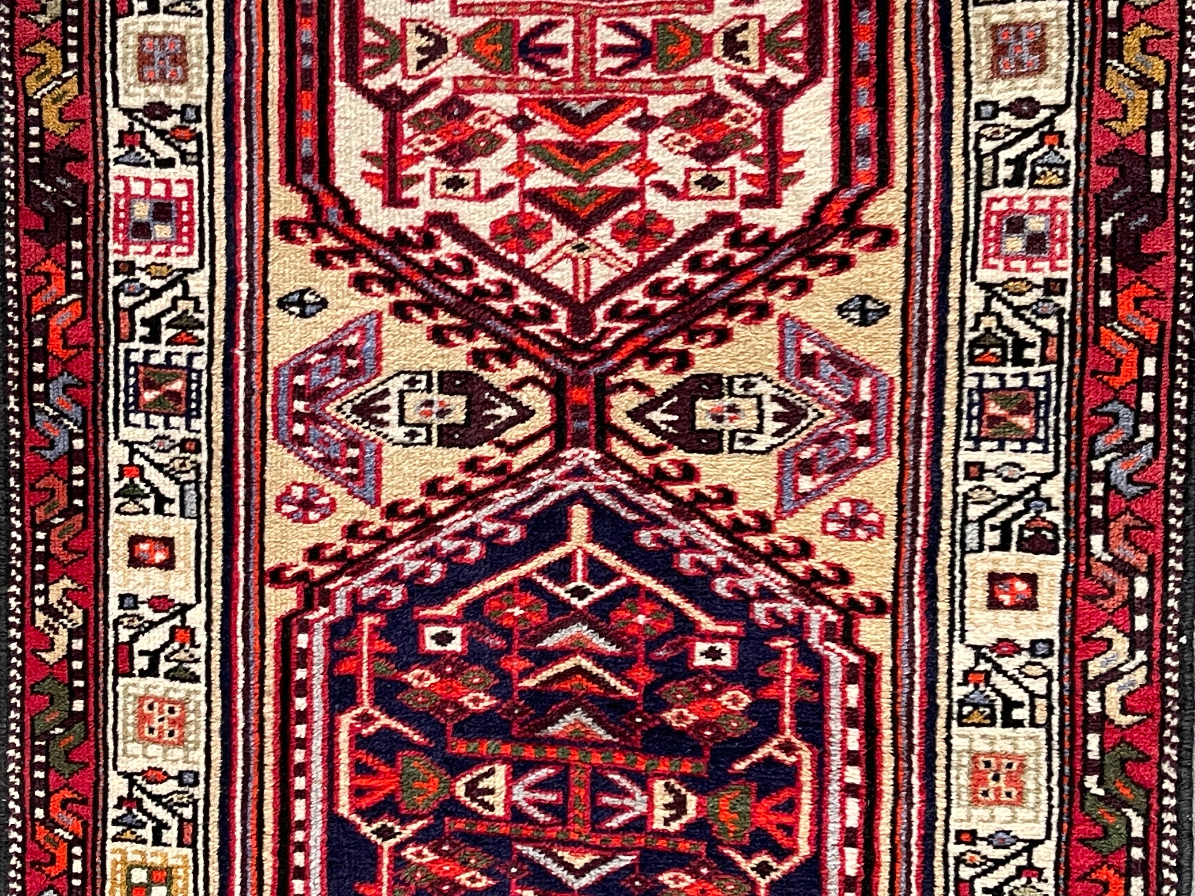 20th Century Persian Lavar Kerman Runner Rug with a beautiful unique design in burgundy/ navy/ gold and tan. Made out of silk and wool and expertly hand knotted. In great vintage condition.

Measures: 2'-8