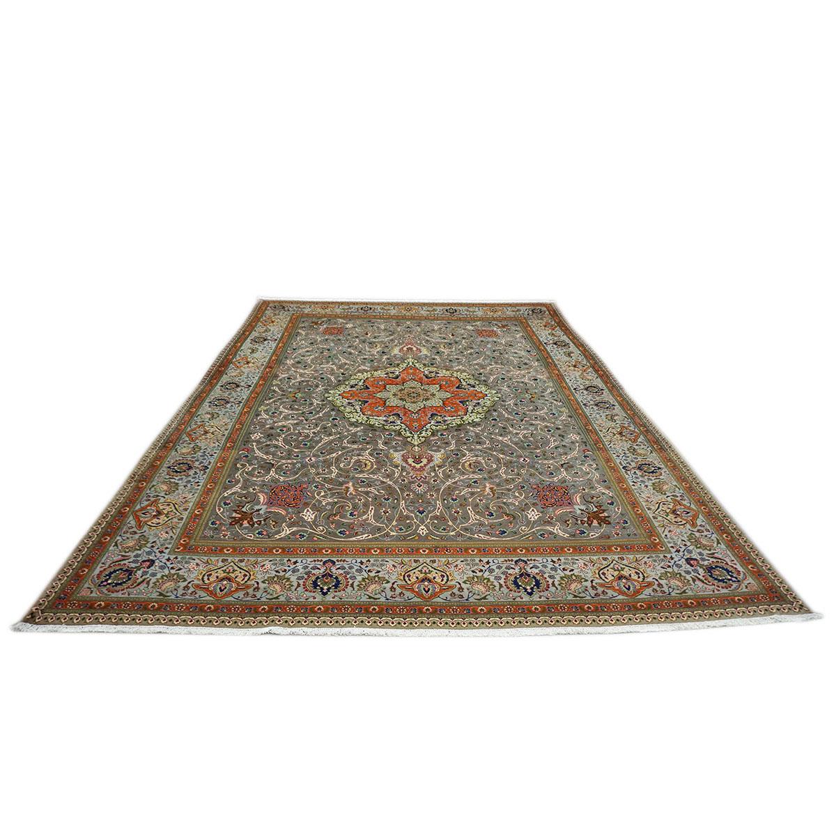 A fine woven 1940s Persian Tabriz with Grey field populated with fine detailed medallion floral designs.
Accent colors include light green, taupe, sage green, and light blue.
The rug is bounded by a burnt orange and light blue floral border. Has
