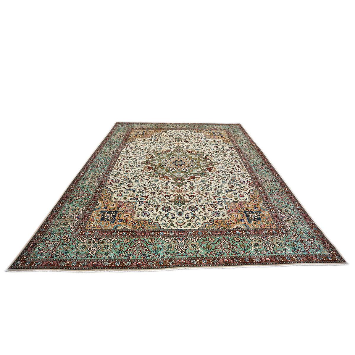 Ashly Fine Rugs presents a Vintage Persian Tabriz 9x13 Ivory, Light Green, and Red Handmade Area Rug. An Ivory field populated with fine detailed medallion floral designs.
Accent colors include light green, taupe, sage green, and light blue.
The rug