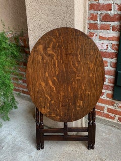 20th Century Petite Antique English Tiger Oak Oval Folding Table Coffee Tea