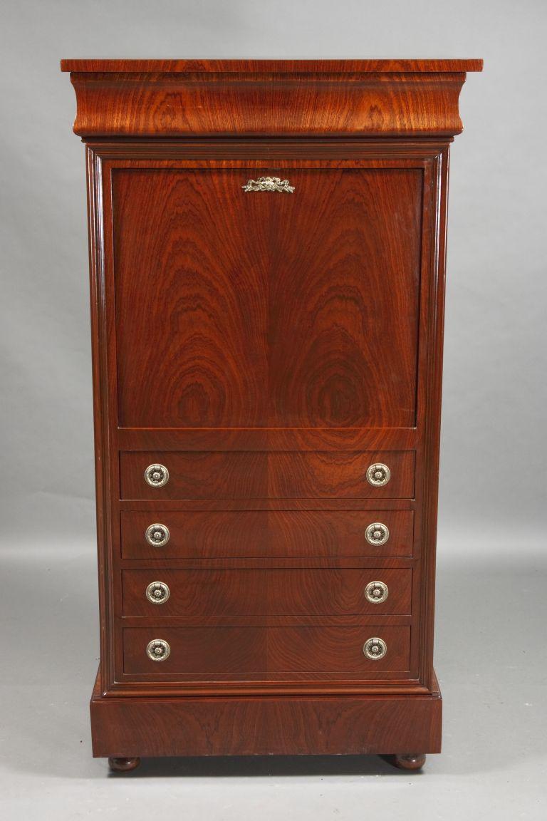 20th century Petite Secretary in Biedermeier style

Mahogany partially blackened, on solid softwood. Rectangular body on flattened ball feet. In the front five drawers of different sizes. Straight writing tablet, behind it architecturally arranged