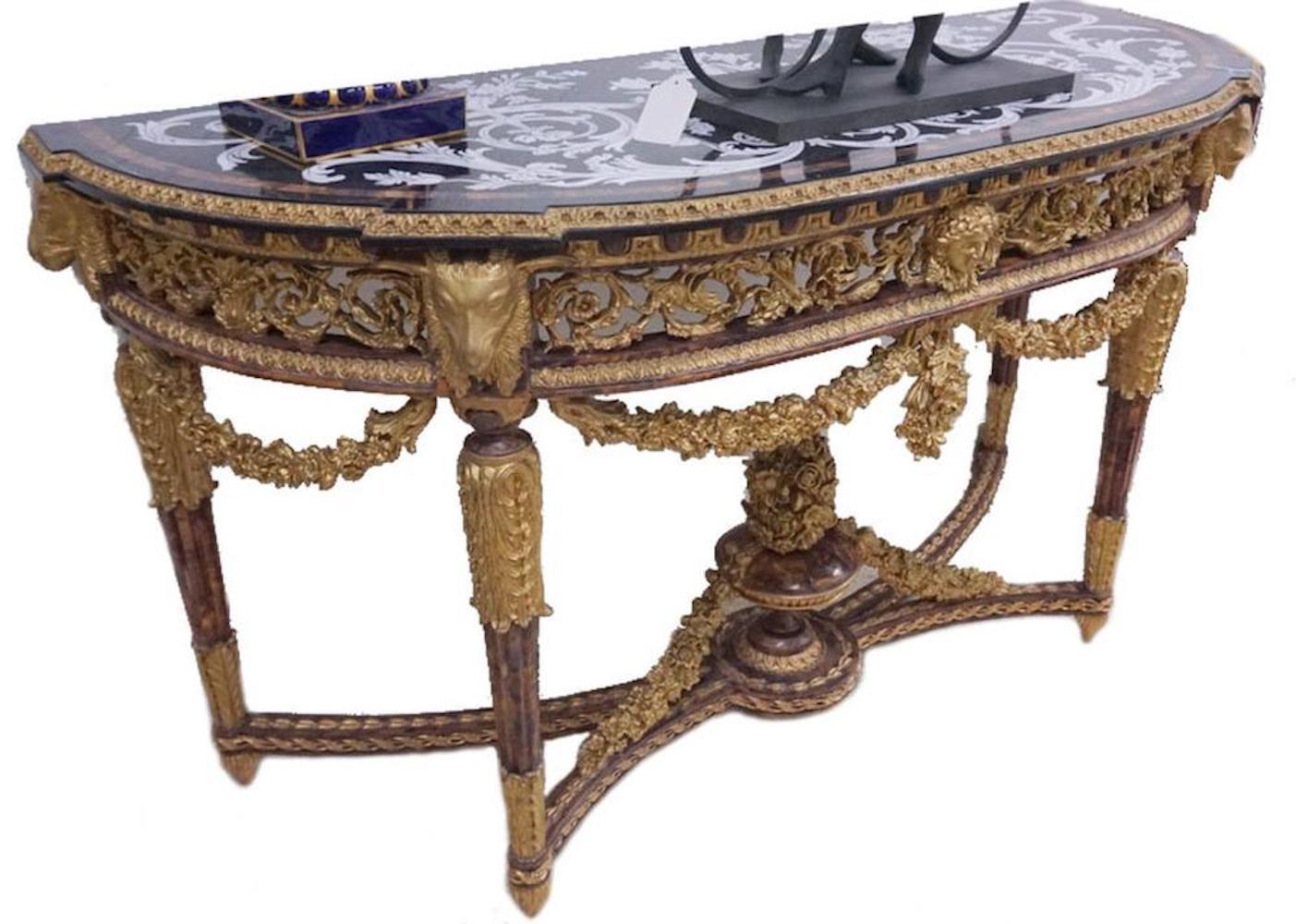 Elaborate, possibly Italian giltwood demilune console table. Beautifully carved decorated with rams heads measures: 64