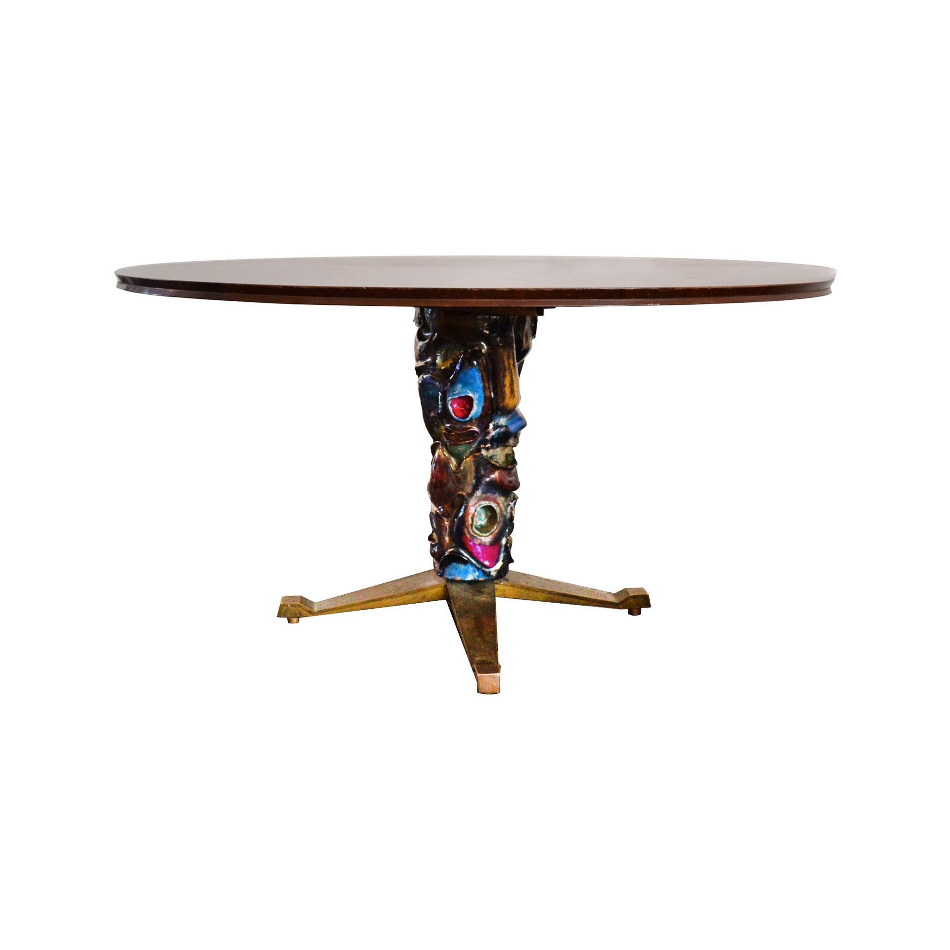 Round wood table designed by the architect Melchiorre Bega and the artist Pietro Melandri as unique piece for a private house in Fregene, Italy. The base of the table has a brass structure covered with special and amazing polychrome ceramic. The