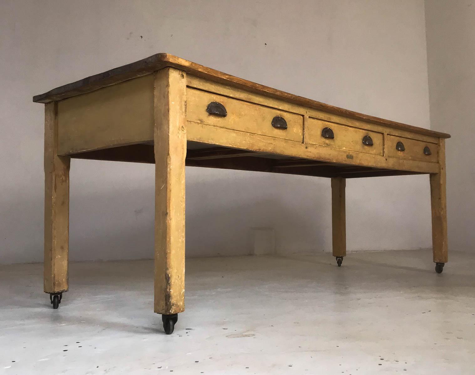 Original pine baker's table sourced from a bakery in Liverpool, England, that was sadly closing its doors for the final time. It was manufactured during the 1930s by renowned bakery fitters T. H. Tonge who were based in Manchester. The pine base has