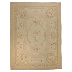 Médaillon central en forme de flore rose, violet et blanc, Aubusson, vers 1920