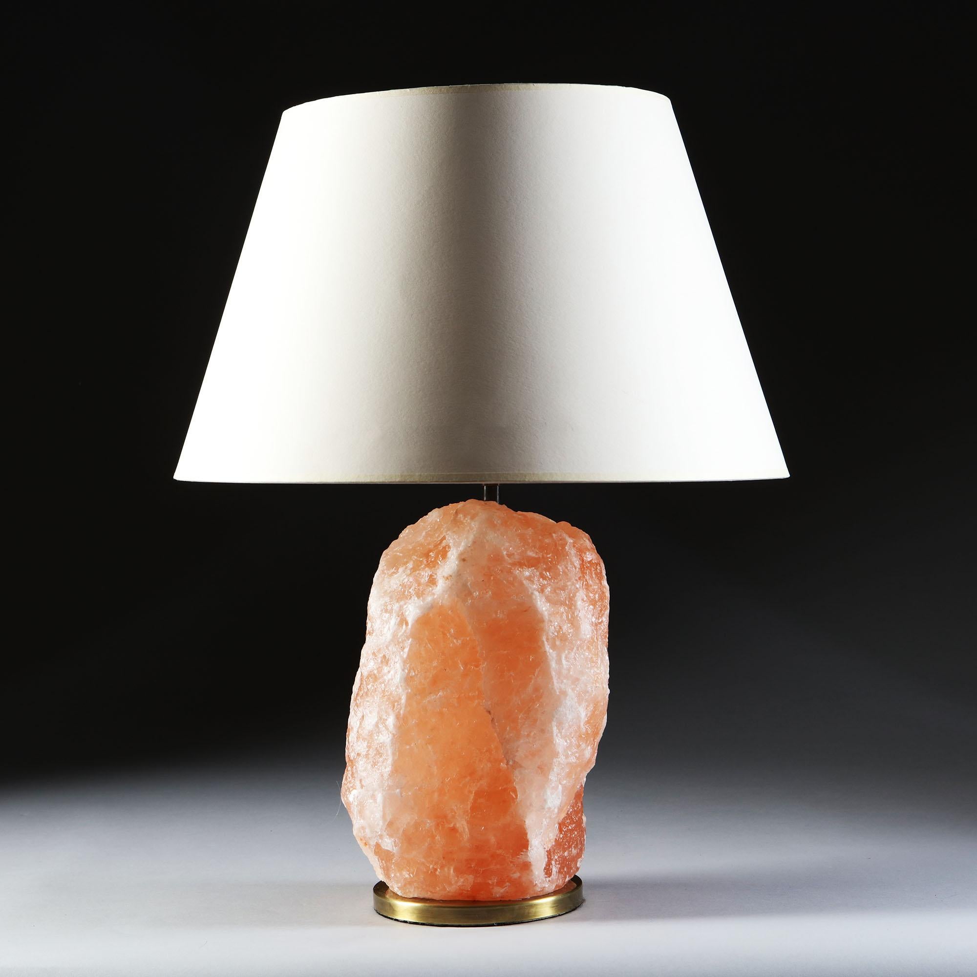 A 20th century pink rock crystal shard, mounted as a table lamp, with a circular brass bass.

Currently wired for the UK. Please enquire for rewiring services.

Please note: lampshade note included.