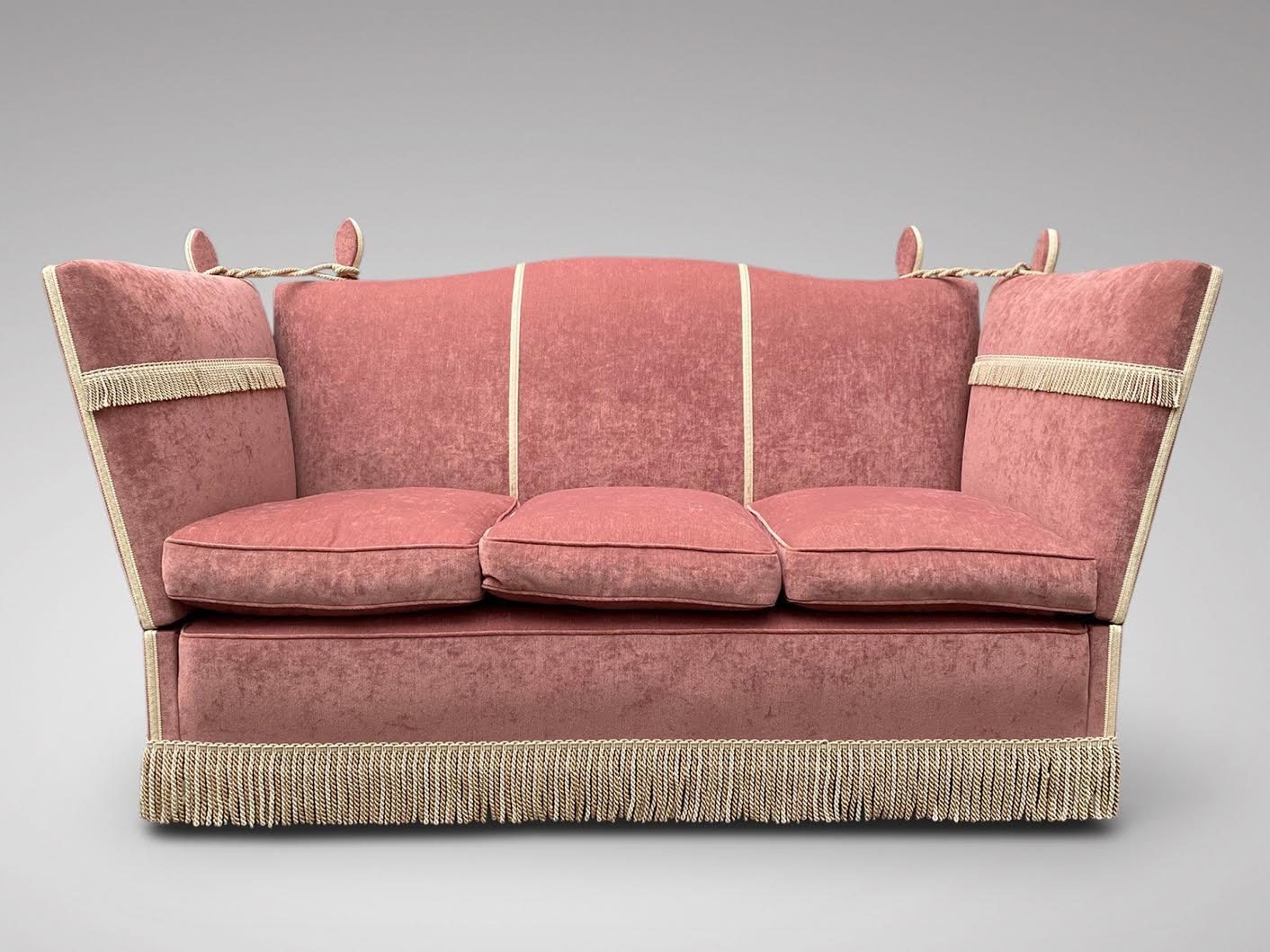 We are delighted to offer for sale this superb quality and very clean three seater Knole sofa. With the high hump shaped backrest and drop sides typical of the form. Sprung seat with deep feather filled seat cushions. Light pink chenille upholstery
