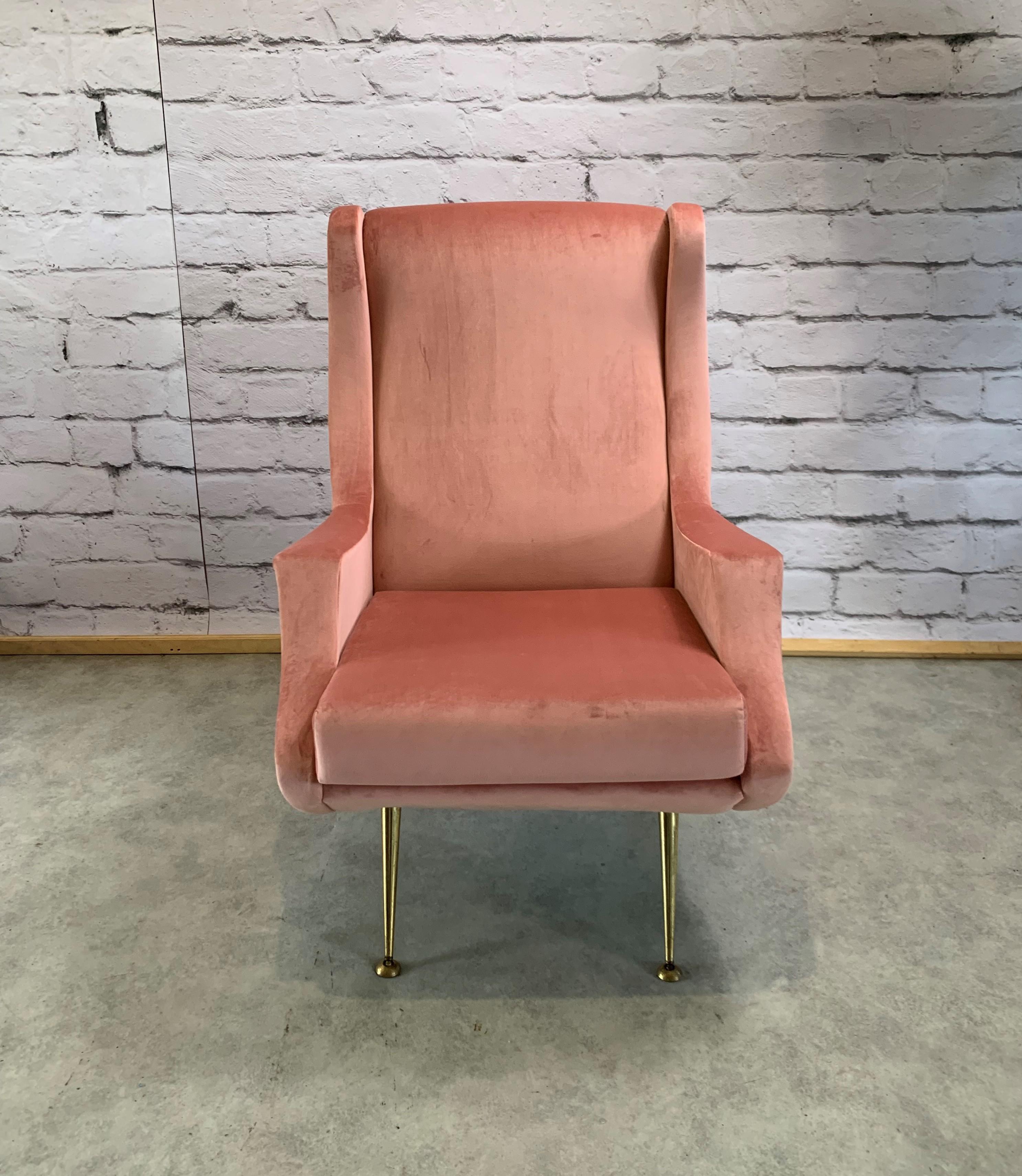 Italian vintage armchair in the style of Marco Zanuso. It is reupholstered with beautiful shiny light pink velvet. It has very stylish original brass legs. Great curved shape. It will fit vintage, regency and international style interiors.