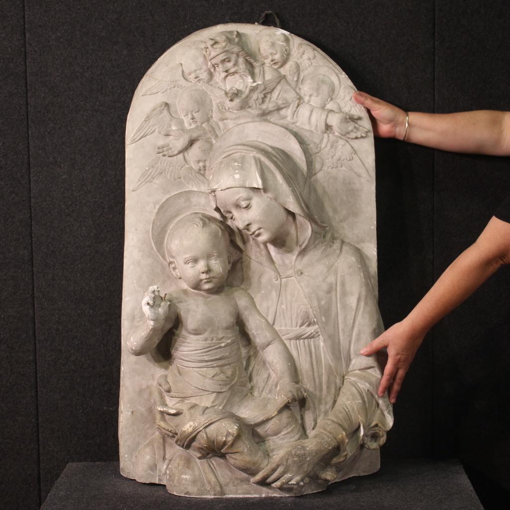 Great Italian high relief from the first half of the 20th century. Plaster work depicting the Madonna and Child, copy of the famous terracotta sculpture by Andrea della Robbia now exhibited at the Metropolitan Museum in New York. Perhaps it is