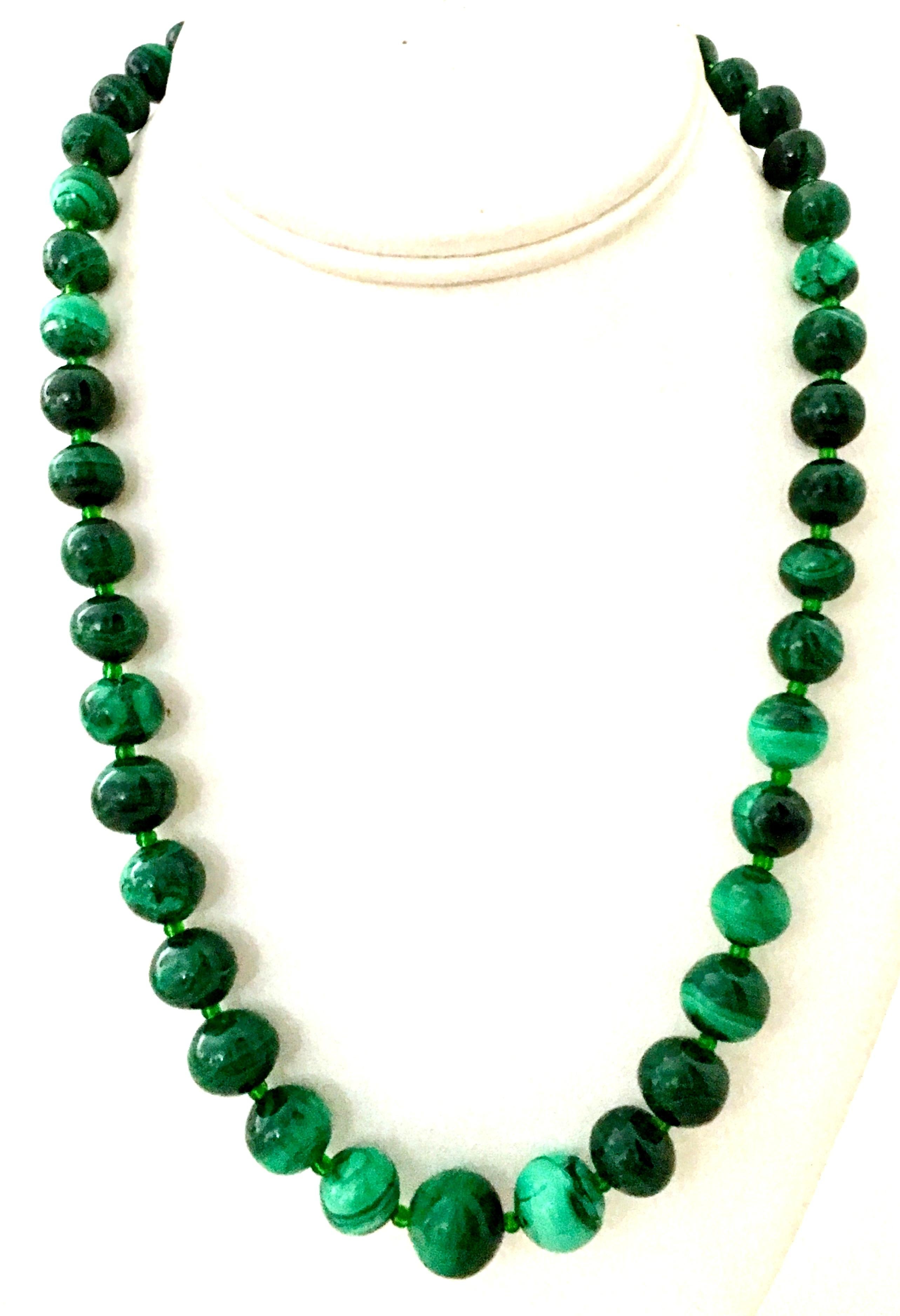 20th Century Polished Malachite Round Graduated Bead Necklace. This gorgeous piece features vibrant variegated authentic emerald green malachite graduated beads with emerald green glass rondelle/spacers. The clasp is chromium plated silver screw